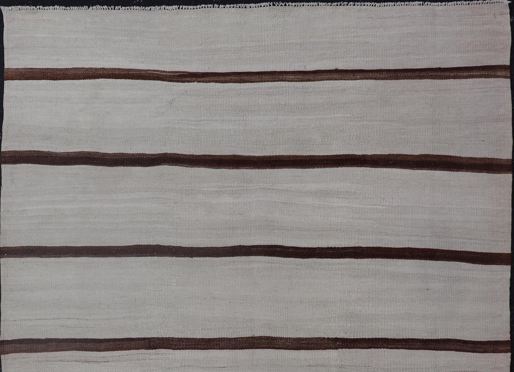 Turkish Vintage Kilim in Shades of Brown and Ivory with Stripe Design. Keivan Woven Arts / rug EN-15170, country of origin / type: Turkey / Kilim, circa 1950
Measures: 4'2 x 5'0 
This vintage striped design Turkish Kilim rendered in shade of browns
