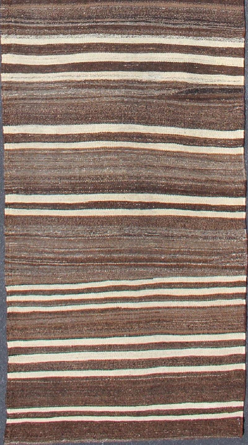 Vintage Kilim runner from Turkey with minimalist stripes in brown and ivory. Keivan Woven Arts / rug EN-39-1, country of origin / type: Turkey / Kilim, circa 1950.

This modern-design vintage runner from Turkey features a stripe design rendered in