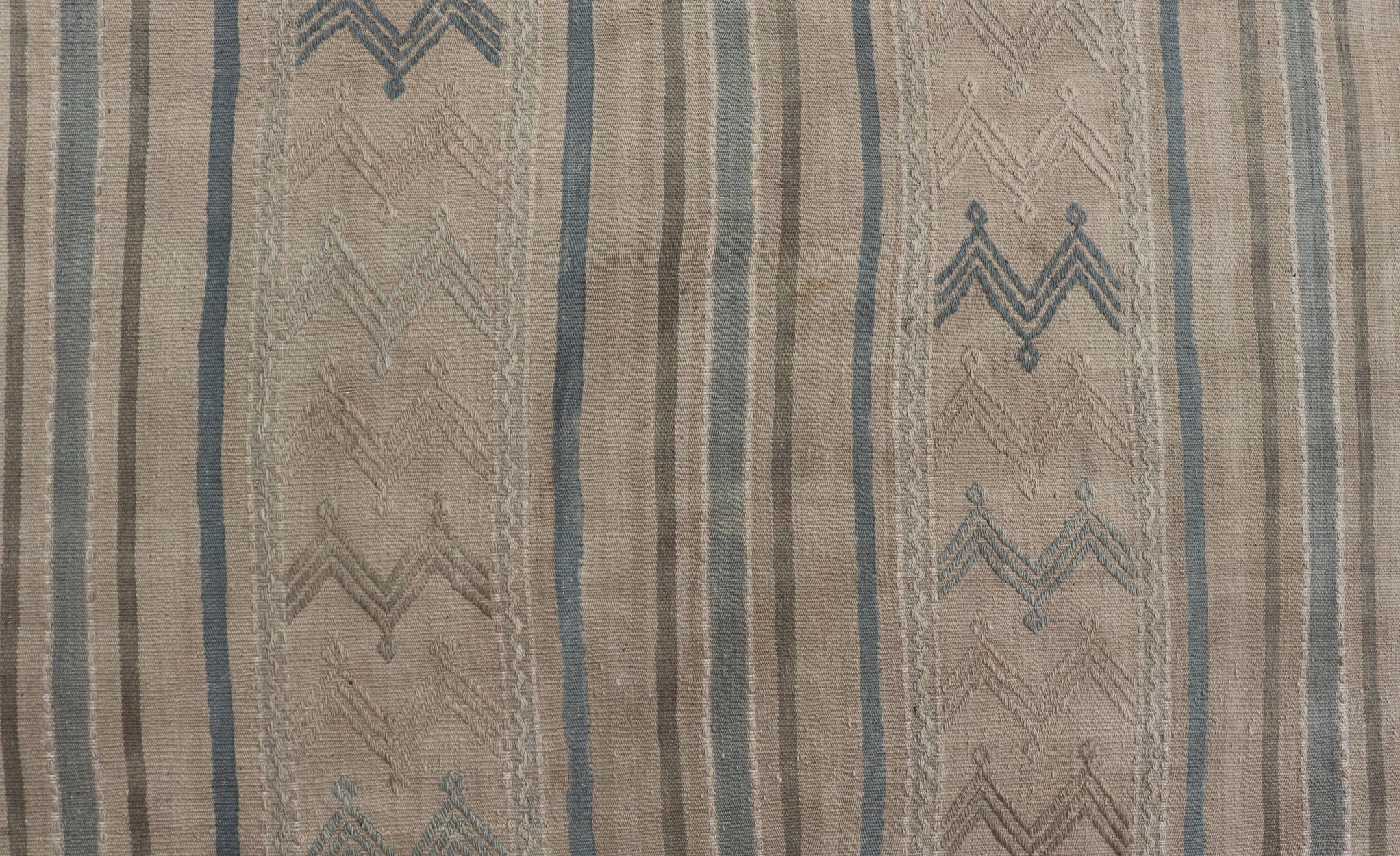 Turkish Vintage Kilim with embroidered motifs with light tan, blue, and brown. Vintage Kilim, Keivan Woven Arts / rug EN-179451, country of origin / type: Turkey / Kilim, circa 1950

Measures: 5'1 x 10'1 

This flat-woven Kilim from Turkey