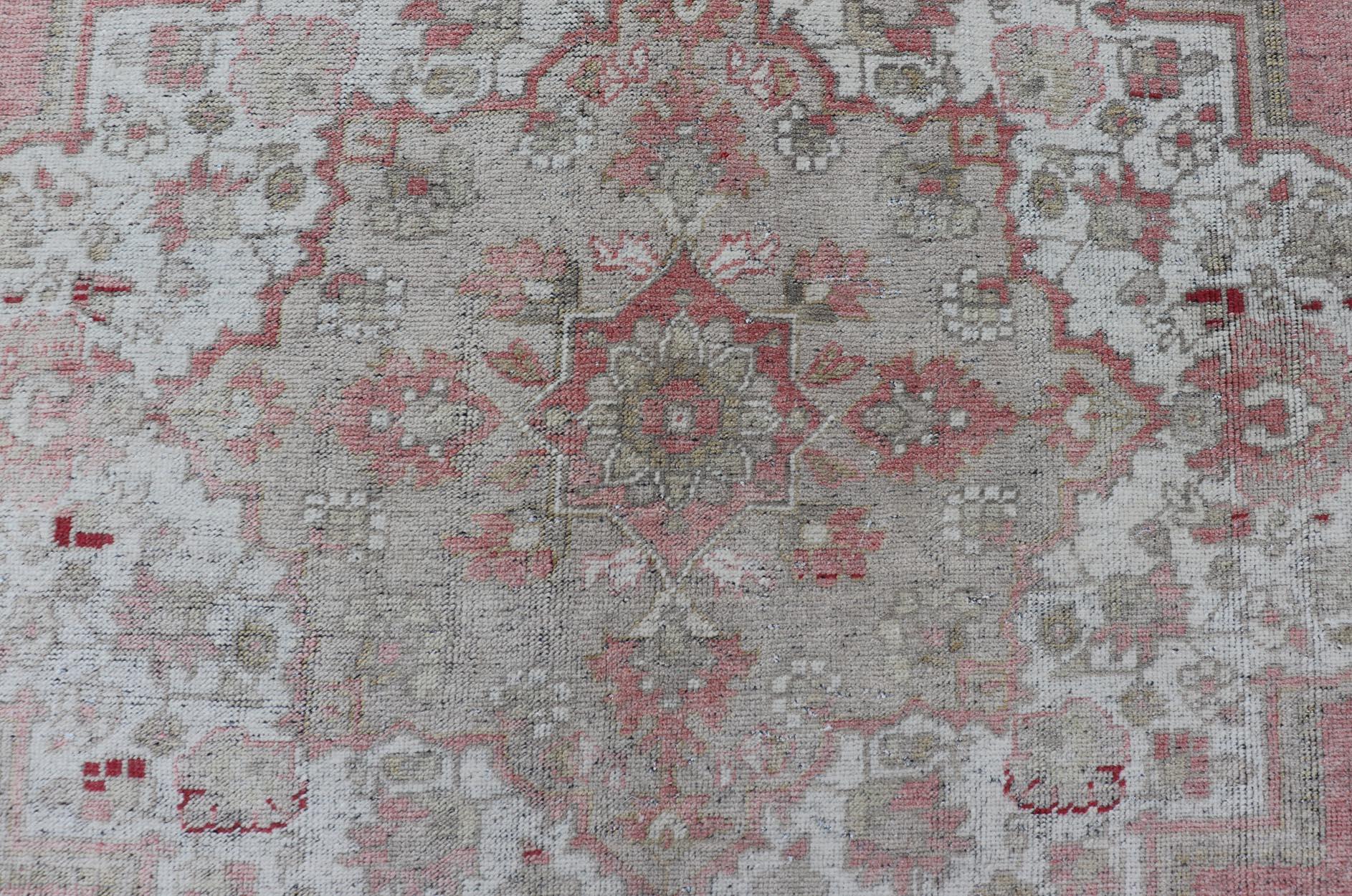 20th Century Turkish Vintage Oushak Rug with Geometric Design With A Soft Coral Color For Sale