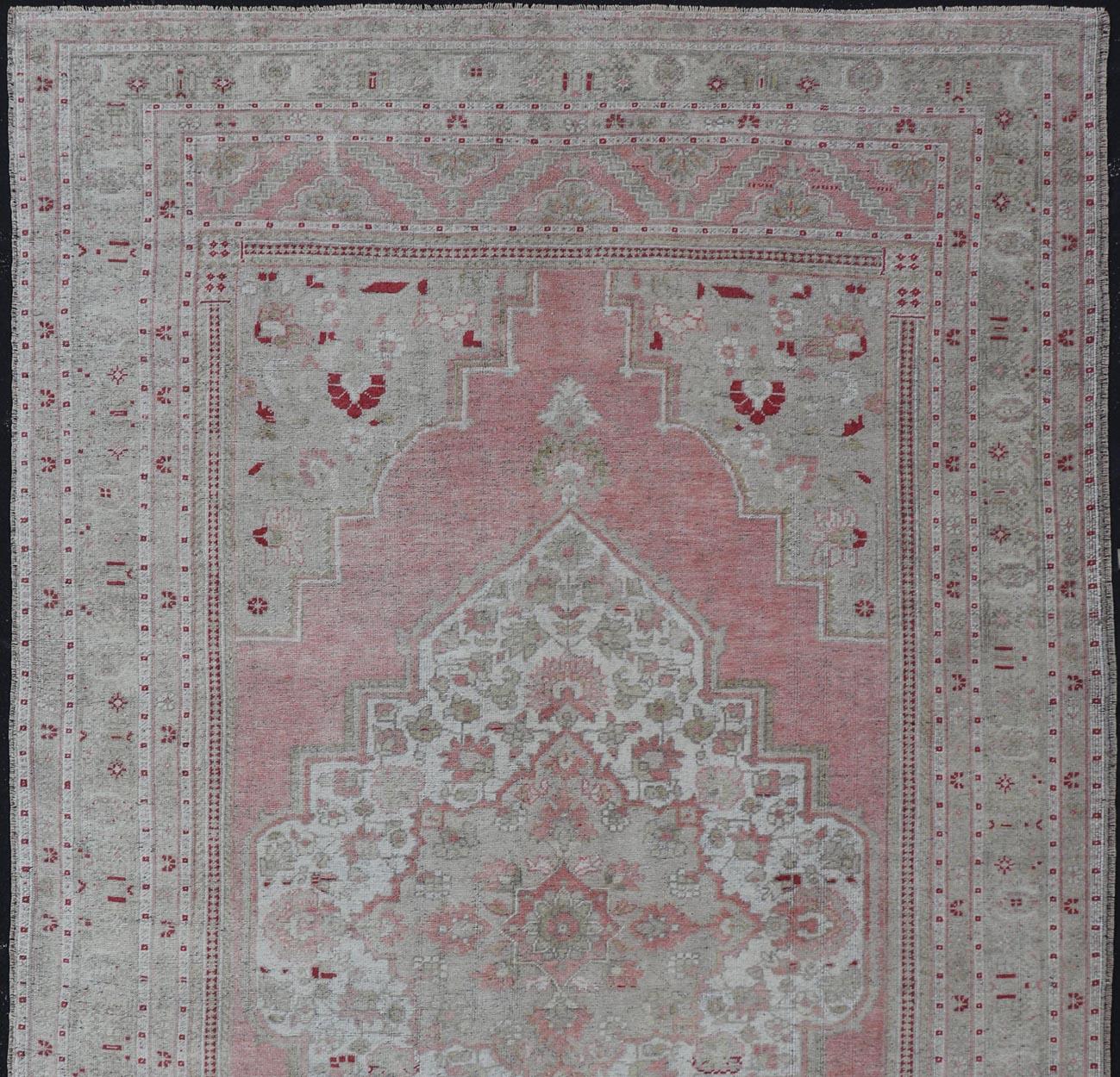 Wool Turkish Vintage Oushak Rug with Geometric Design With A Soft Coral Color For Sale