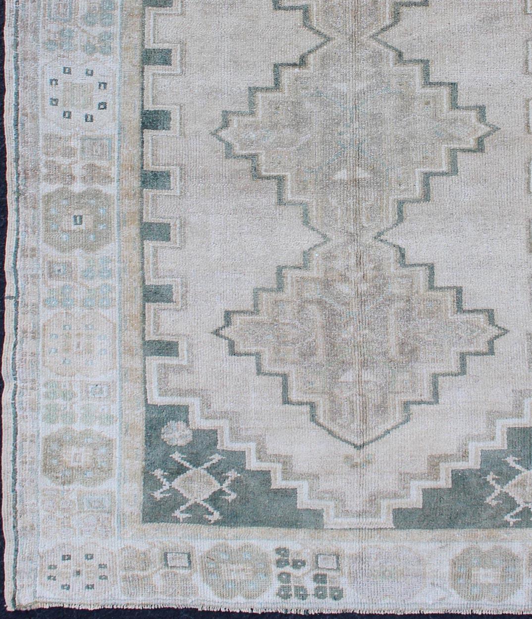 Hand-Knotted Turkish Vintage Oushak Rug with Tribal Pattern in Gray Green and Neutral Tones