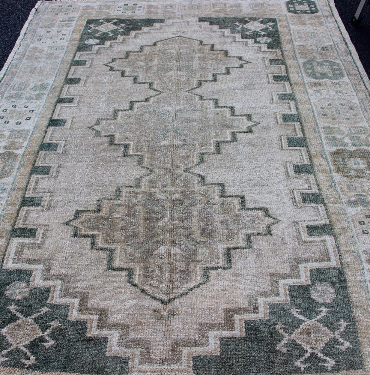 Wool Turkish Vintage Oushak Rug with Tribal Pattern in Gray Green and Neutral Tones