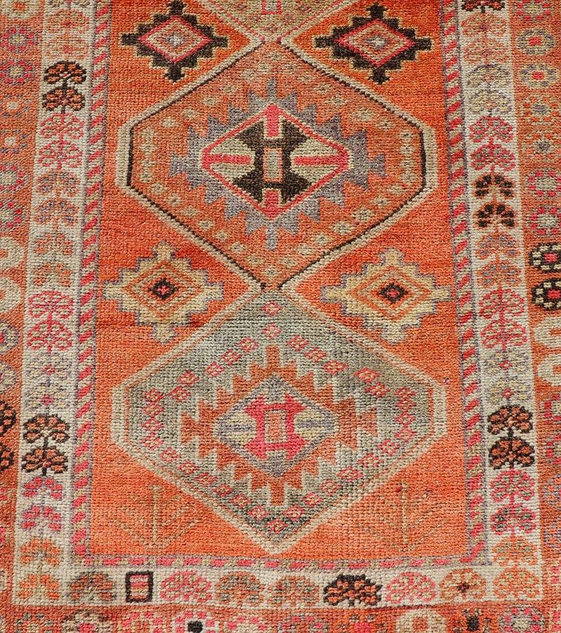 Measures: 2'9 x 13'3 
Turkish vintage oushak runner with Tribal Medallion Design in orange and ivory. Keivan Woven Arts / rug TU-NED-4685, country of origin / type: Turkey / Oushak, circa 1950.

This beautiful vintage Turkish runner features a