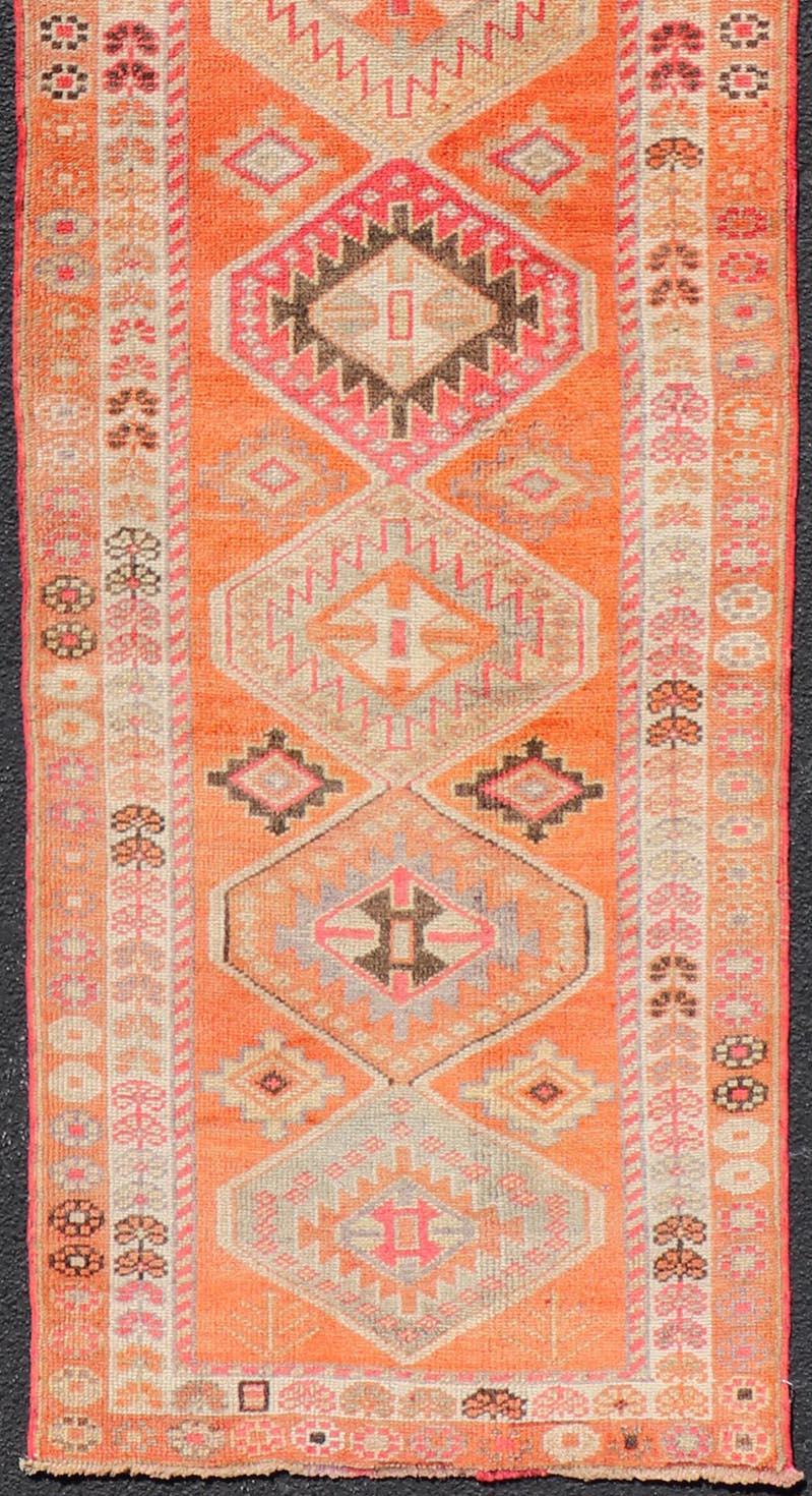 20th Century Turkish Vintage Oushak Runner with Tribal Medallion Design in Orange and Ivory For Sale