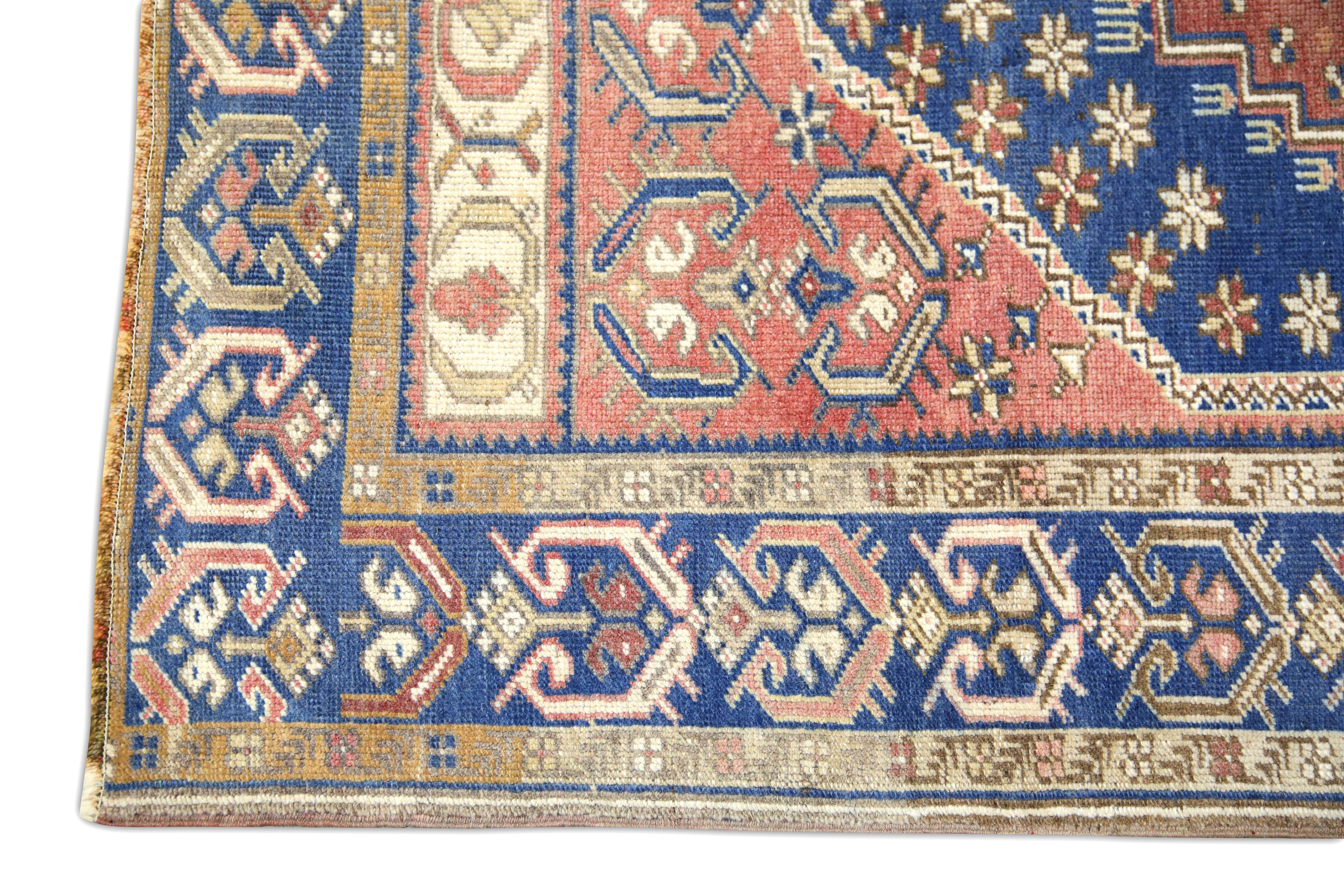 Alfombra vintage turca Alfombra azul y rosa tejida a mano 3'5