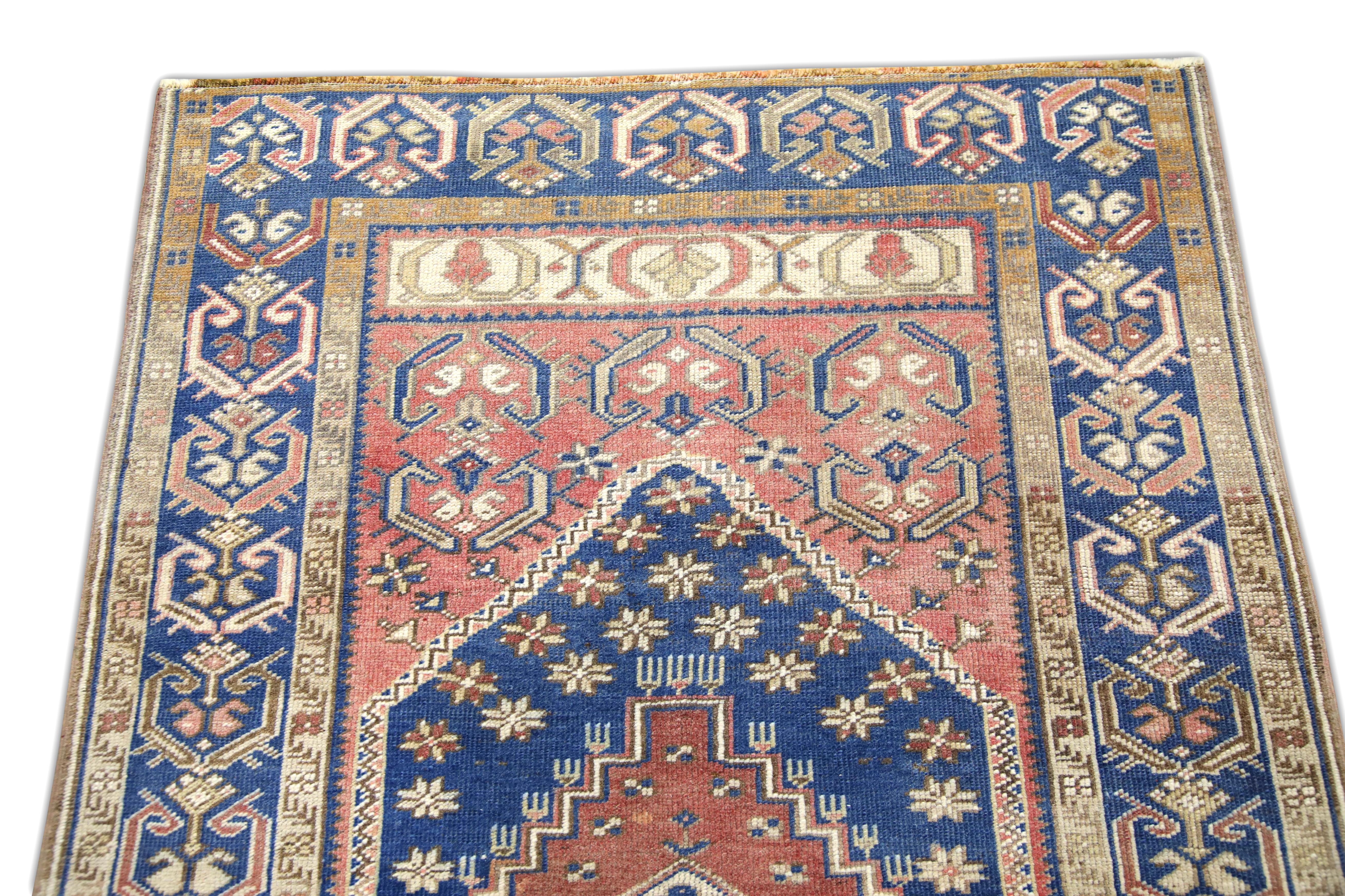 Alfombra vintage turca Alfombra azul y rosa tejida a mano 3'5