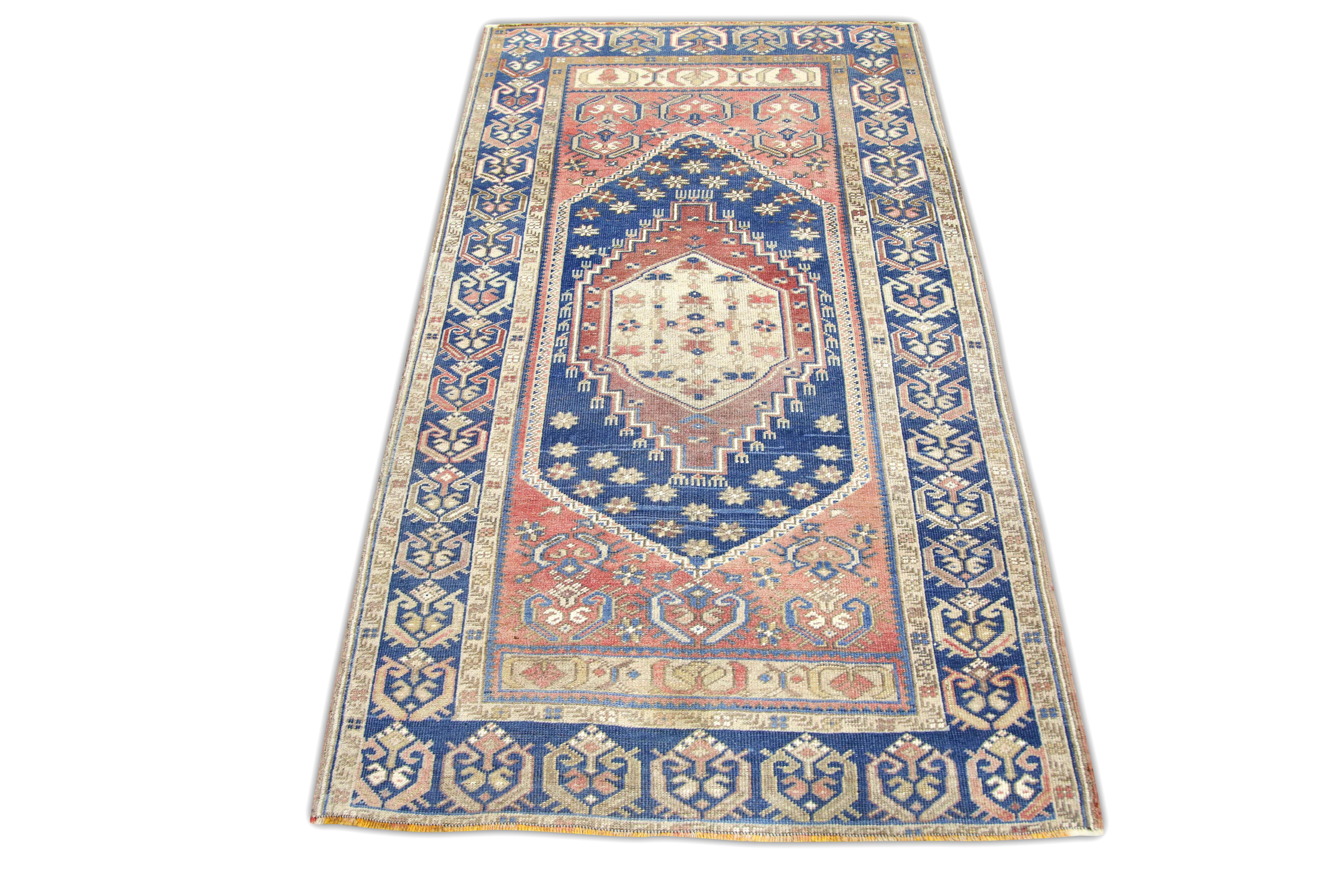 Alfombra vintage turca Alfombra azul y rosa tejida a mano 3'5