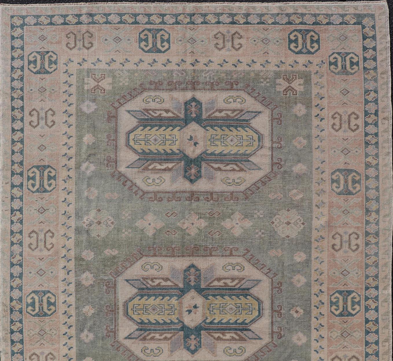 20th Century Turkish Vintage Tribal Medallion Oushak in Muted Green, Blue, and Cream For Sale