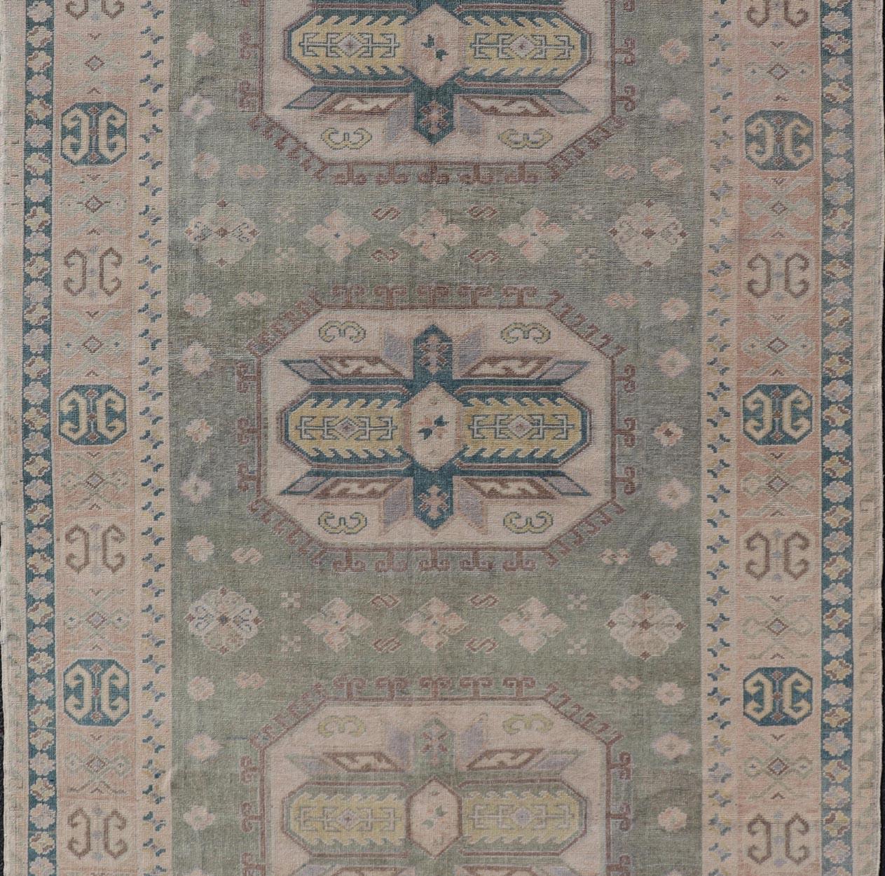 Wool Turkish Vintage Tribal Medallion Oushak in Muted Green, Blue, and Cream For Sale