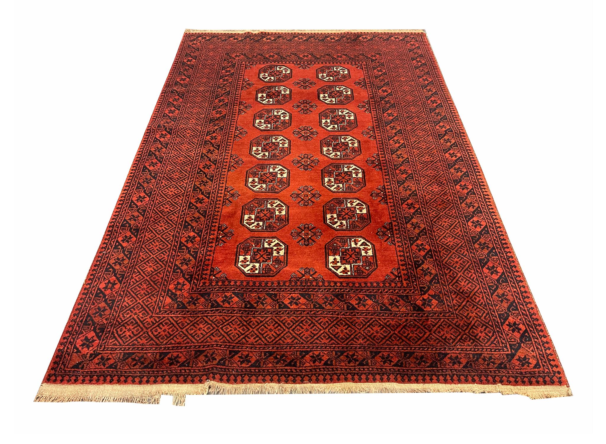 Decorated with a unique colour pallet of gold, red and deep blue this fantastic wool rug is sure to uplift any room it's introduced to. Featuring a detailed all-over medallion with a highly-detailed floral surround design and border. The colour and