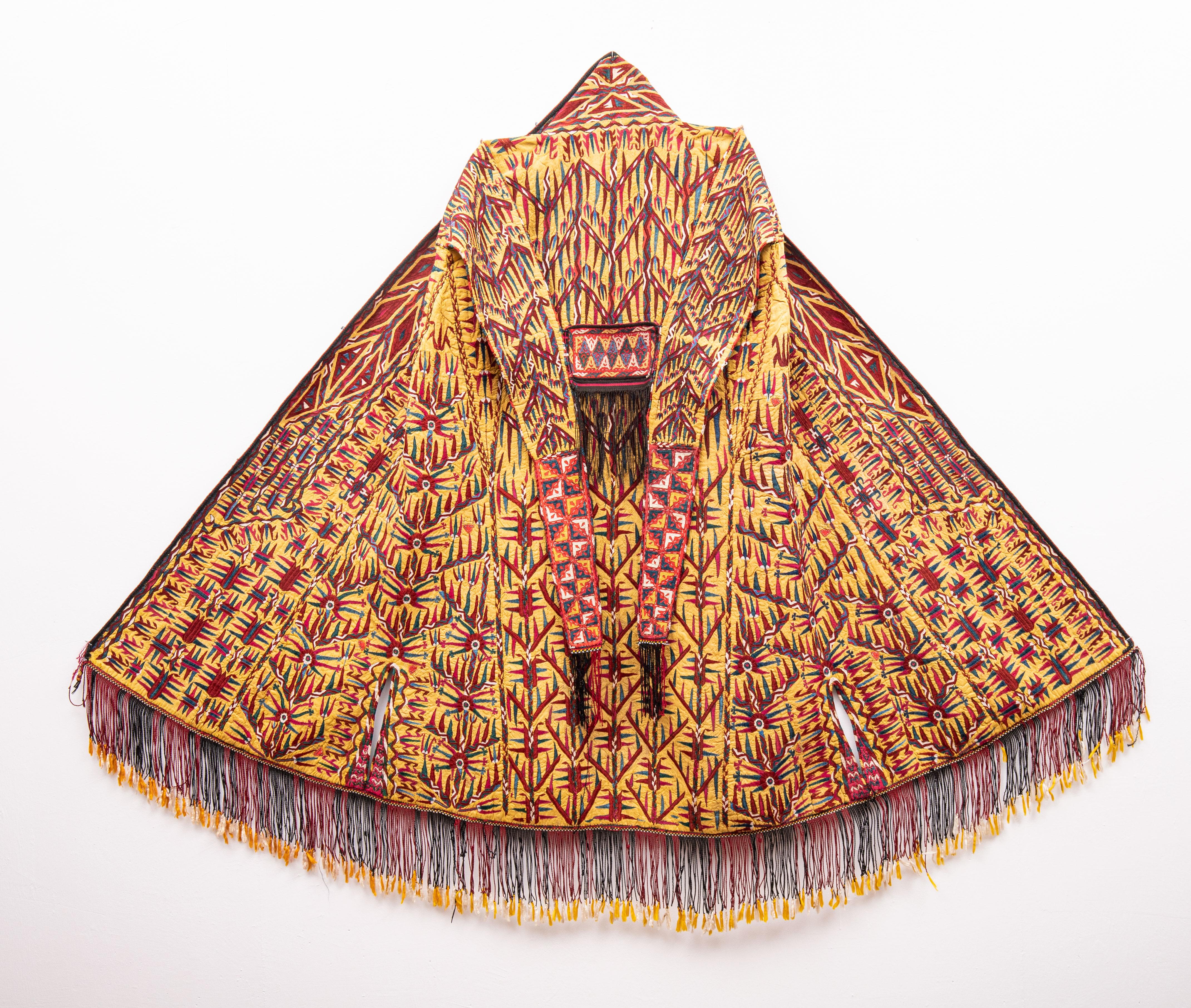An exclusive Turkmen tribal chyrpy, a gown worn over the head or shoulder with decorative sleeves is an iconic Turkmen textile art.