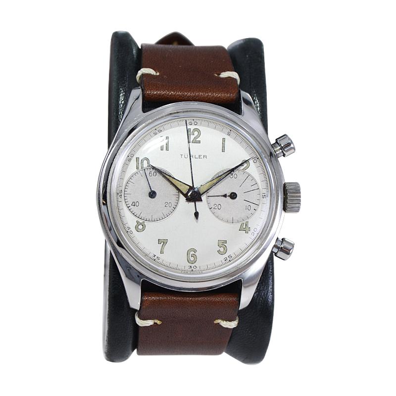 FACTORY / HOUSE: Turler Watch Company
STYLE / REFERENCE: Round Two Register Chronograph
METAL / MATERIAL: Stainless Steel
DIMENSIONS: Length 42mm  X Diameter 36mm
CIRCA: 1953
MOVEMENT / CALIBER: Manual Winding / 17 Jewels / Valjoux
DIAL / HANDS: 