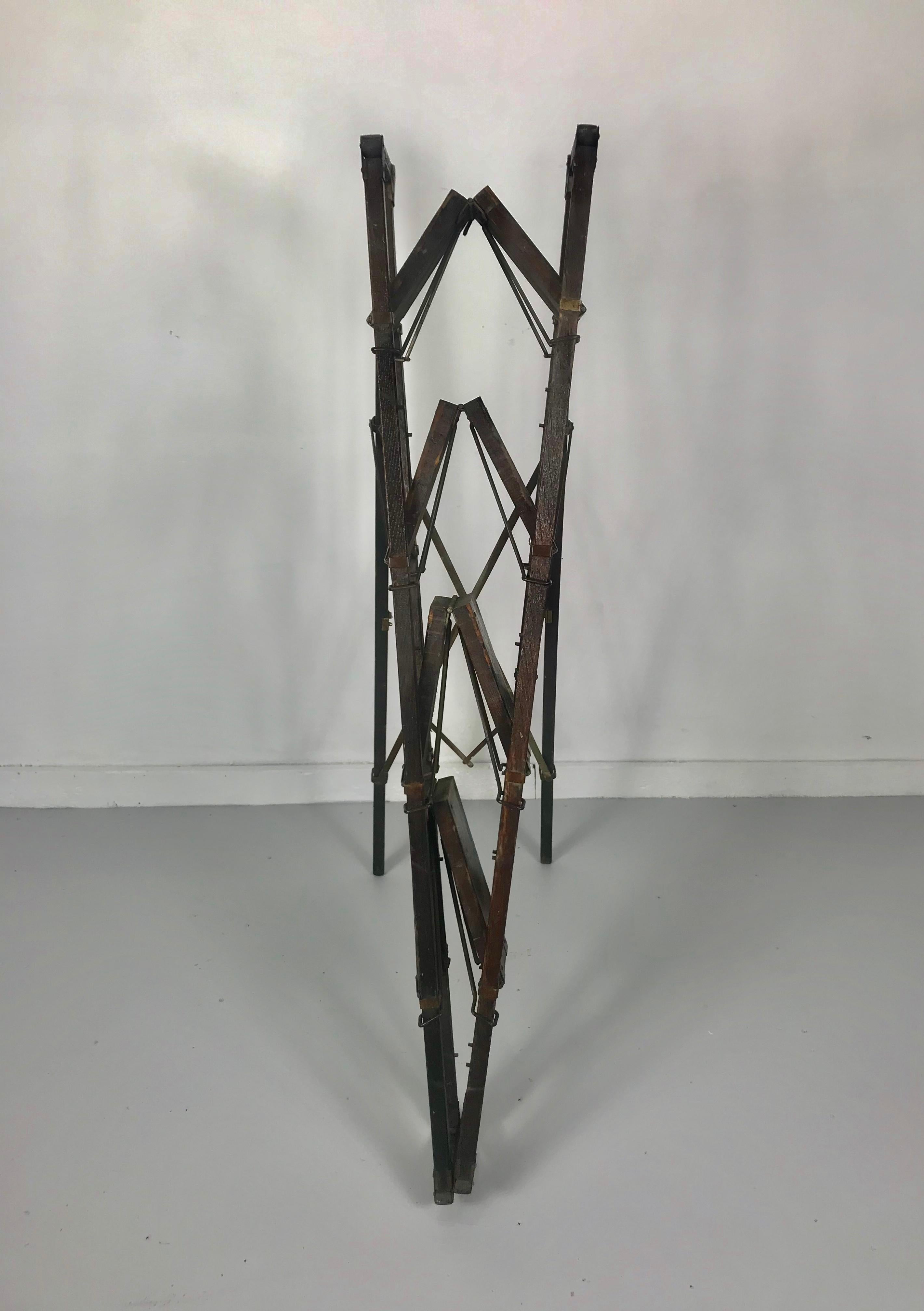 Rare turn of century industrial collapsable step ladder, truly amazing design and engineering, folding and collapsing to 8