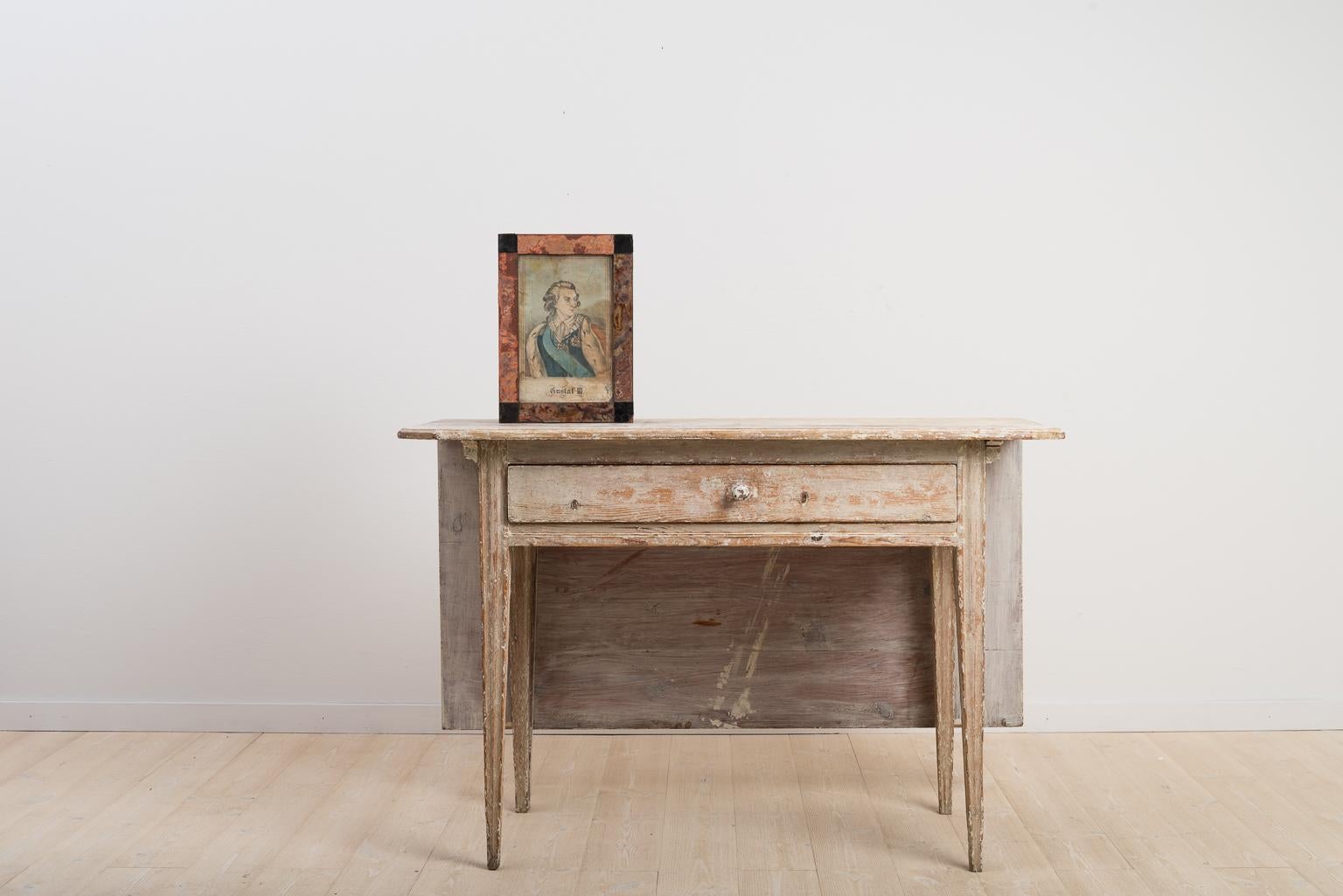 Provincial Gustavian desk with straight tapered legs manufactured around the turn of the century 1700-1800. The table is the 18th century’s solution to compact living as ut can be used as a desk, side table and a dining room table. The tables were
