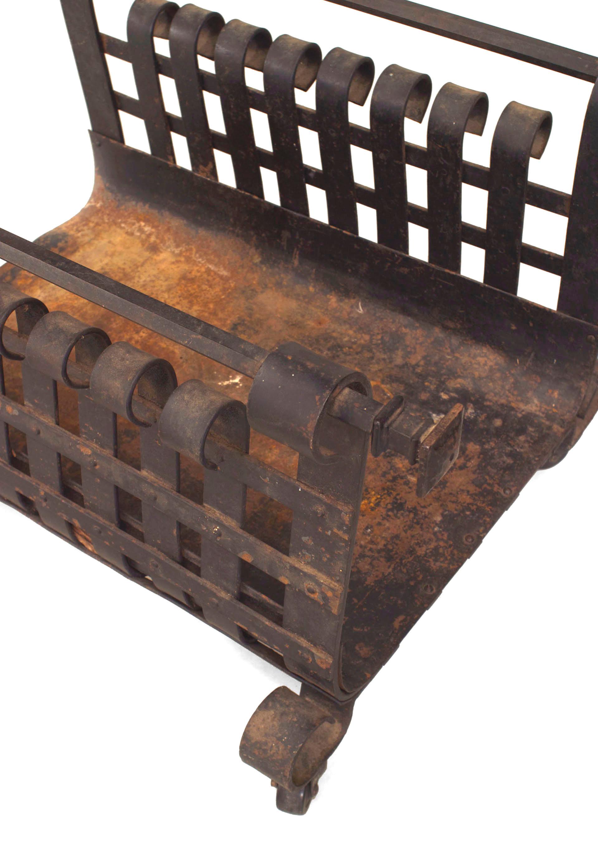 American Mission-style (19/20th Century) wrought iron log holder magazine rack with a scroll design sides.
