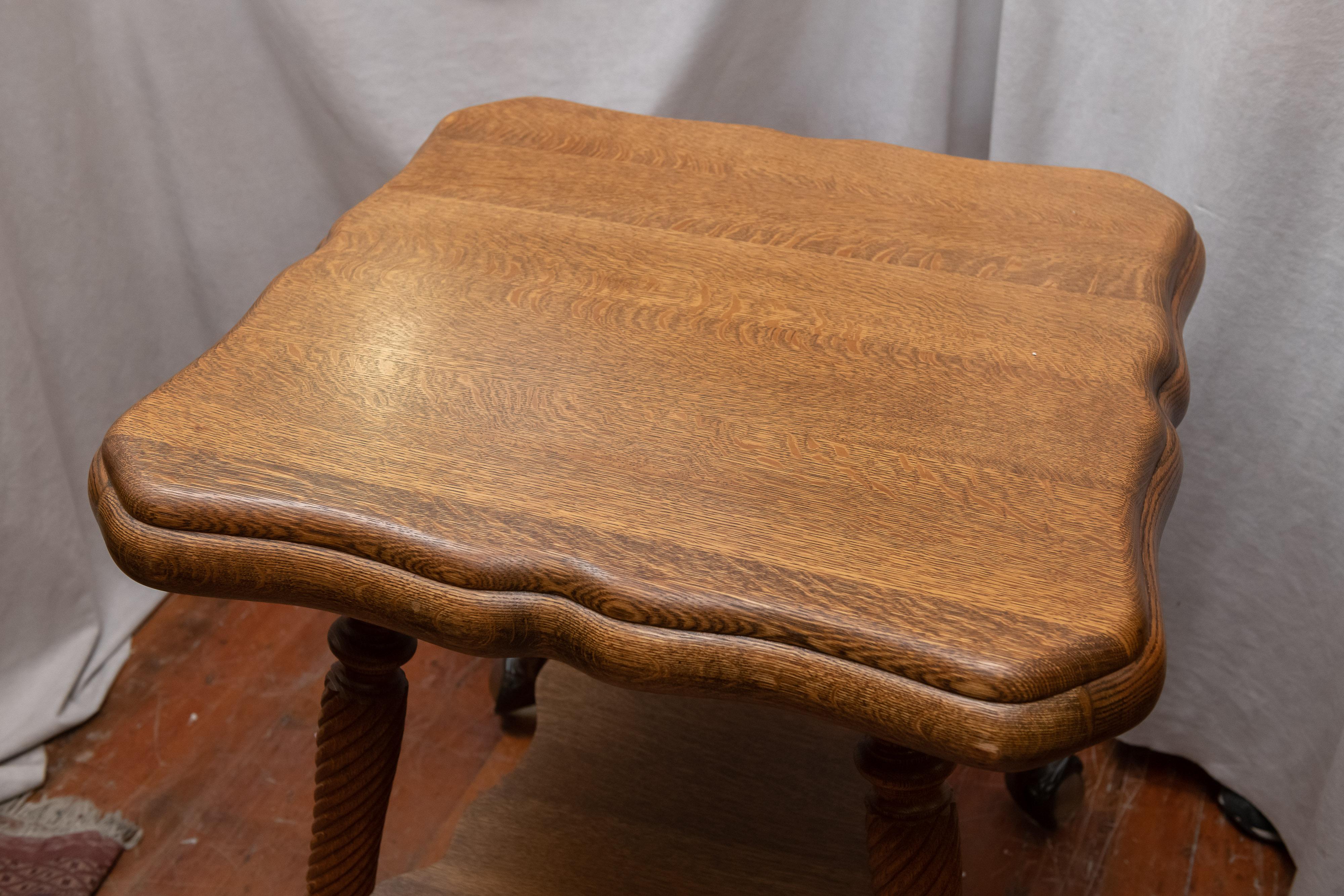 This is a nice example of what quality furniture was being made here in the U.S, circa 1900. Made of all solid oak, no veneer and having that nice curvy double oak top as well as the striking, metal and glass, ball and claw feet. A very good clean