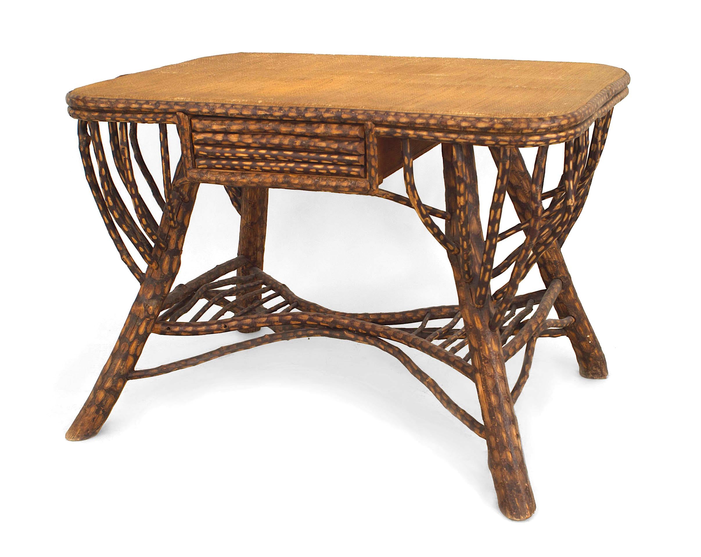American Rustic (19/20th Century) twig / willow design table desk with a single drawer and flared open design sides and stretcher with a woven top.
 