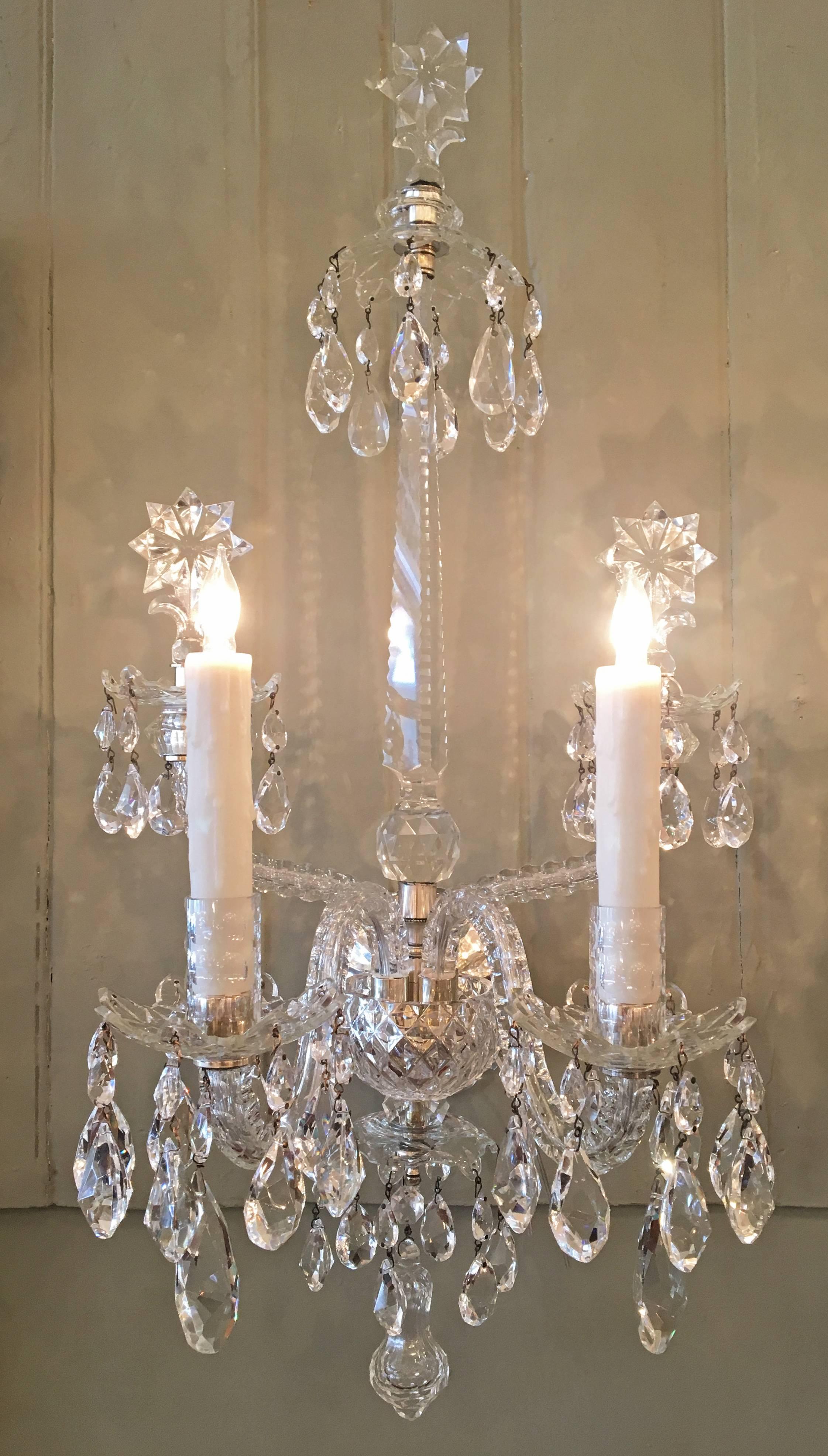 George II style, turn of the century, Anglo Irish crystal sconces. Made of lead crystal with silver mounts.


