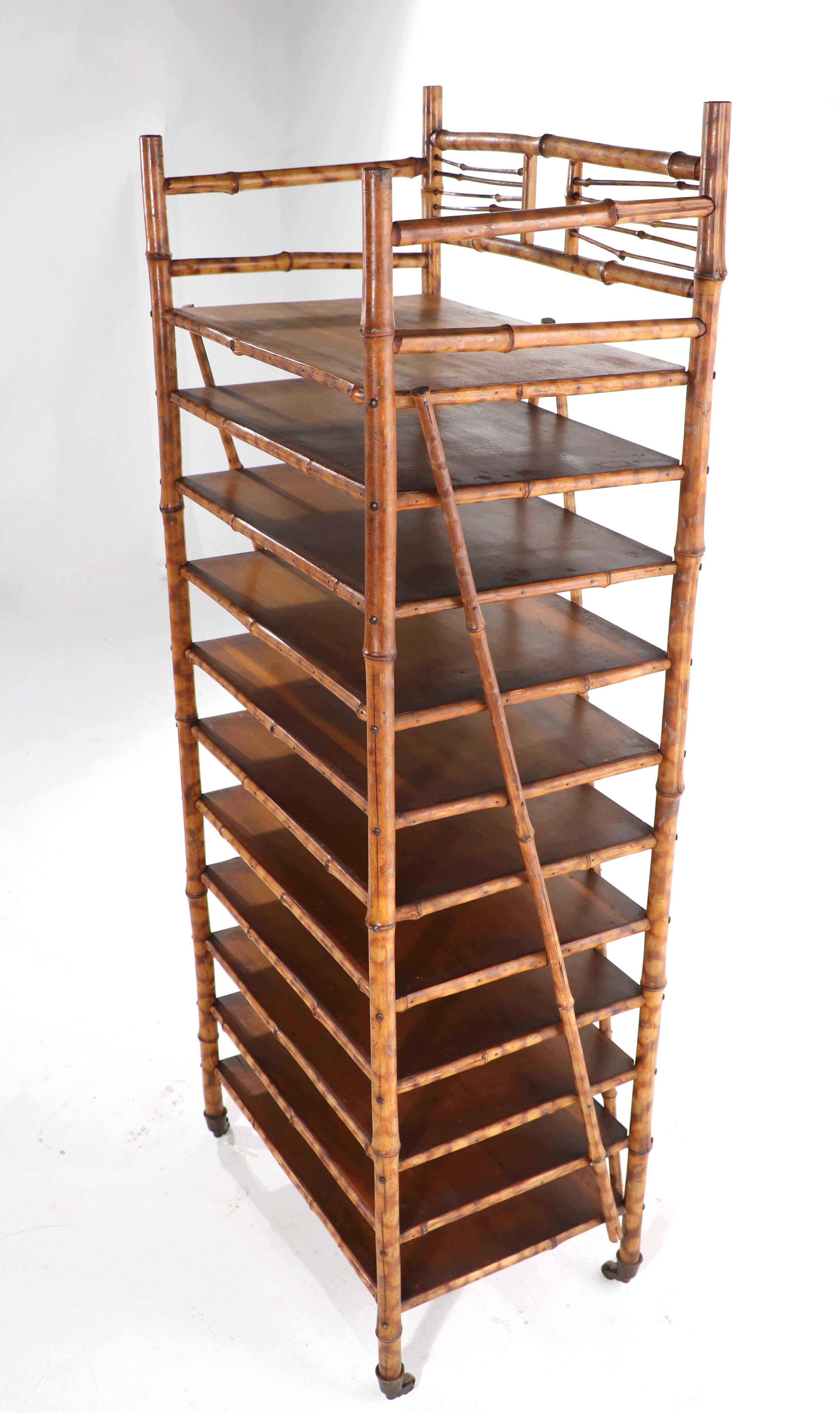 Unusual antique bamboo shelf having 11 shelves, each 2.5 inch lower than the next, making this stylish shelf perfect for storing and organizing paper documents, artwork etc. Chic architectural form, great original condition, clean and ready to use