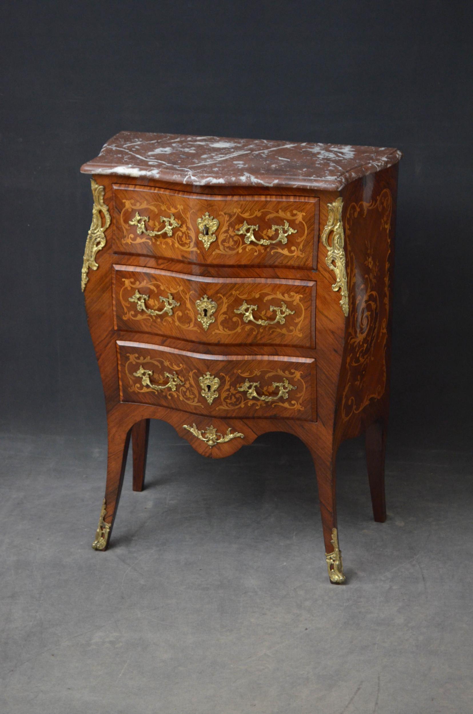 Sn5099, very attractive bombe commode in kingwood, having original veined marble top over three oak lined drawers with handmade dovetails, all fitted with original working locks and a key and decorated with satinwood floral scrolls on rosewood