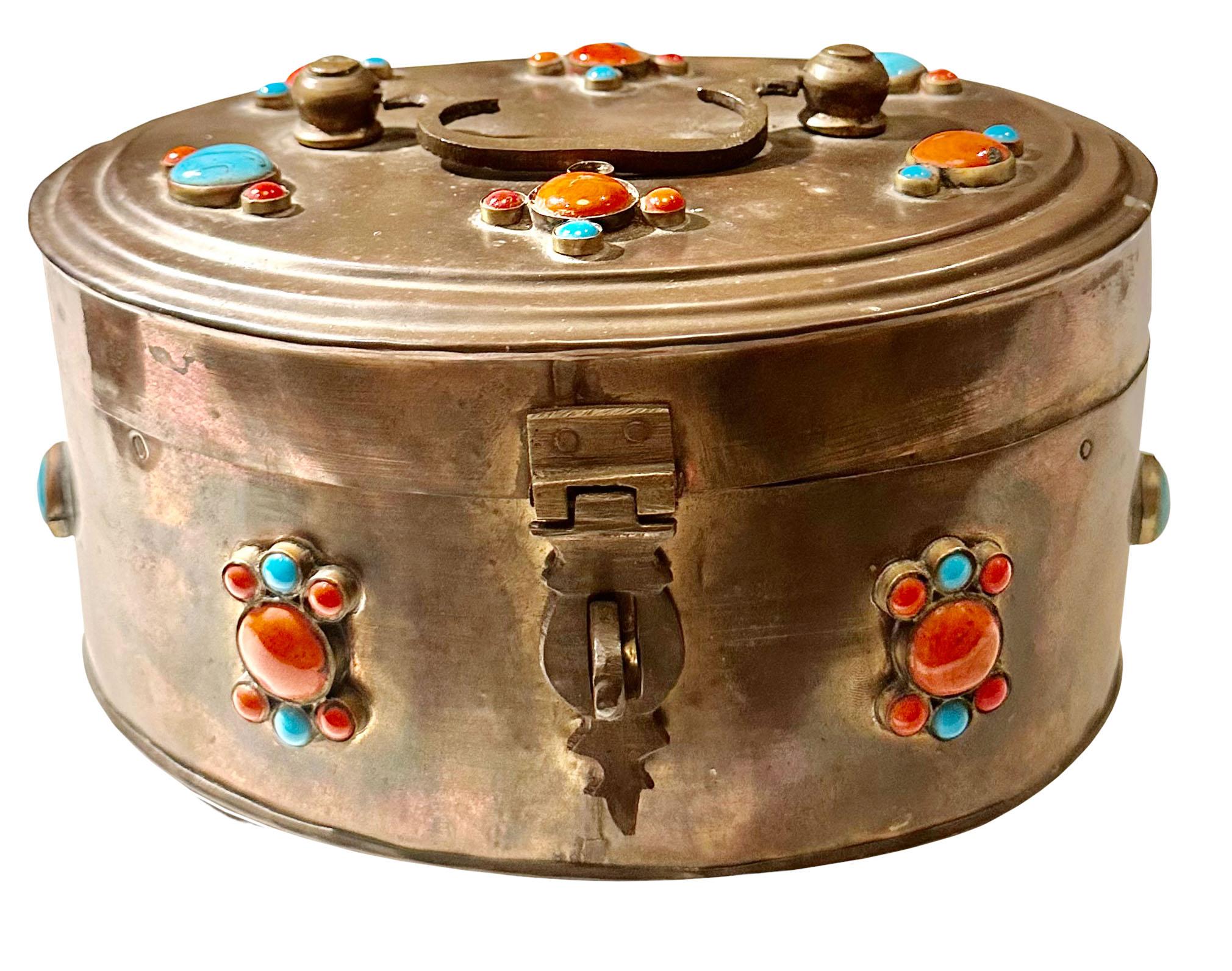 A brass box with turquoise and coral. Turn of the century, India.