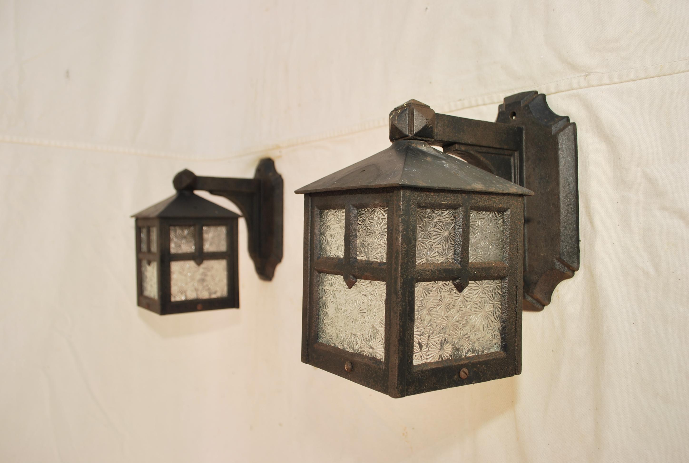 Arts and Crafts Turn of the century cast iron outdoor sconces For Sale