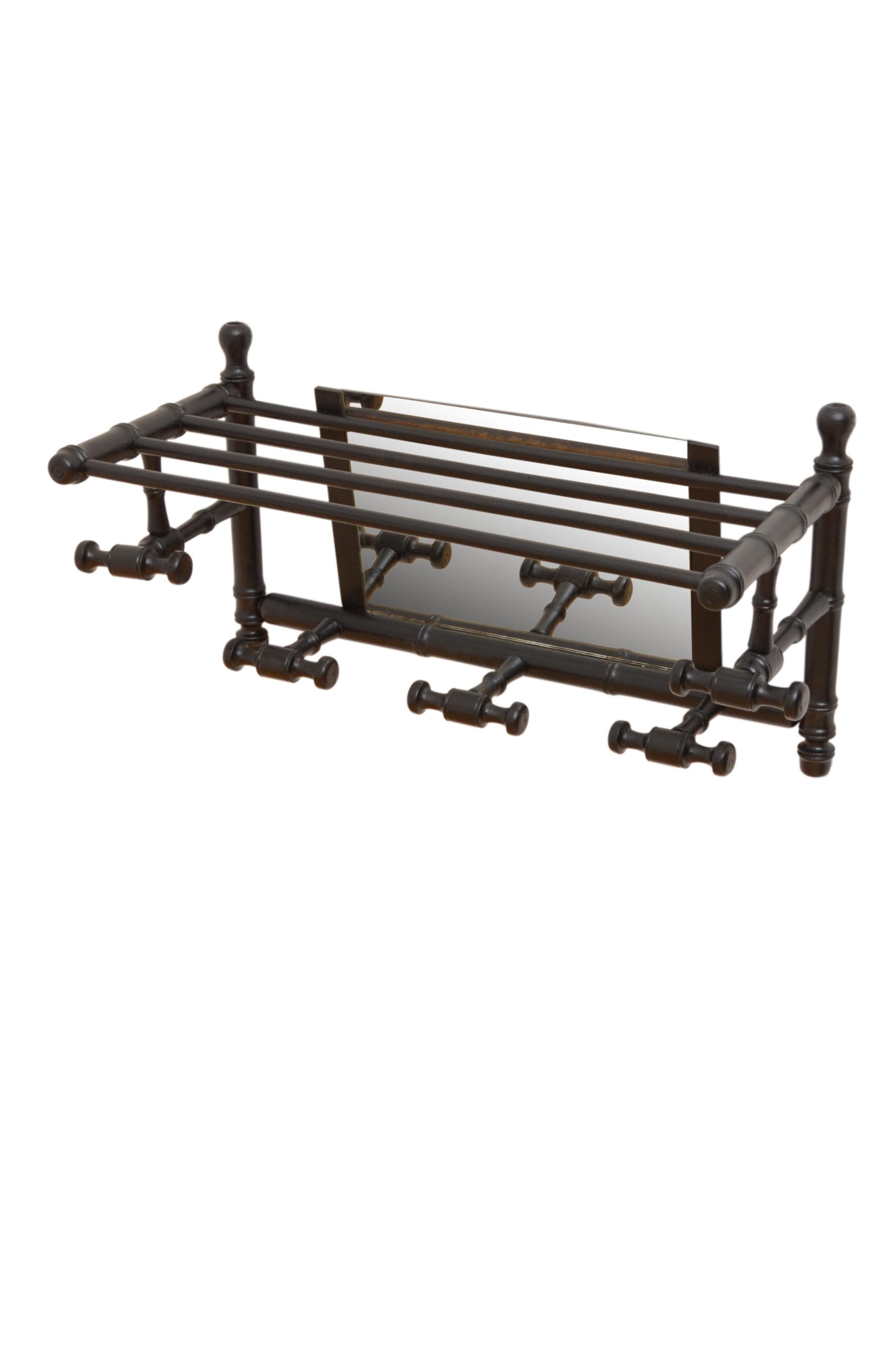 Stylish French faux bamboo, ebonized portmanteau coat and hat rack with an old mirror with some imperfections, all fitted with four hanging brackets. These antique hooks are in home ready condition. No cracks, woodworm free, circa 1900.
Measures: H