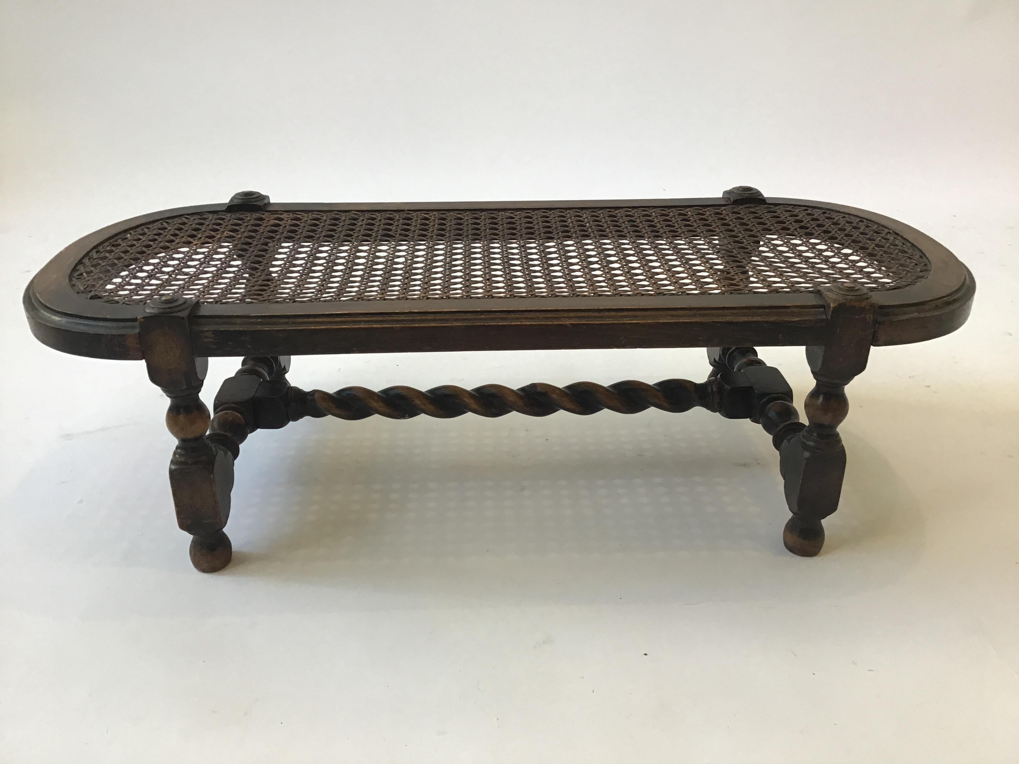 Turn of the century English hand caned footstool.