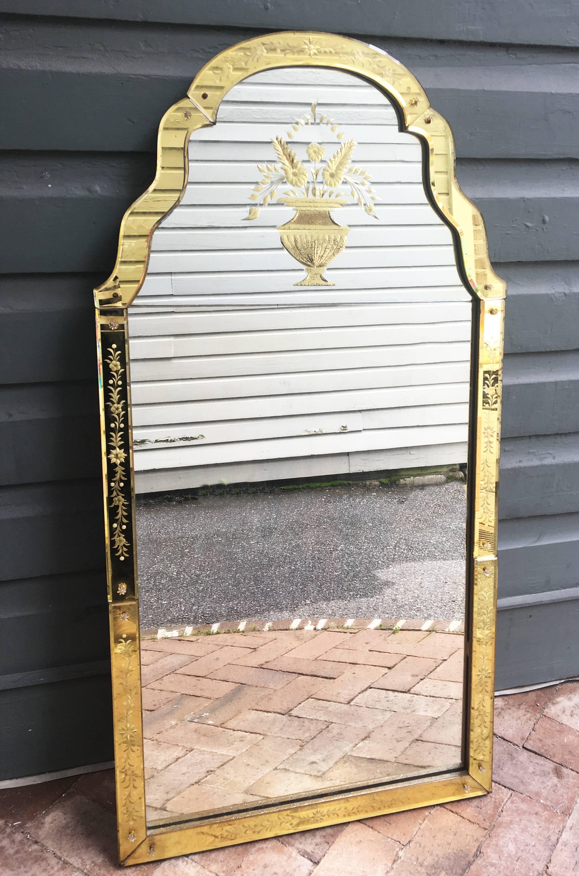 Turn of the century French Art Deco mirror with beautiful citrine colored glass etched and beveled frame. Citrine colored urn with flowers gives this mirror a unique look.