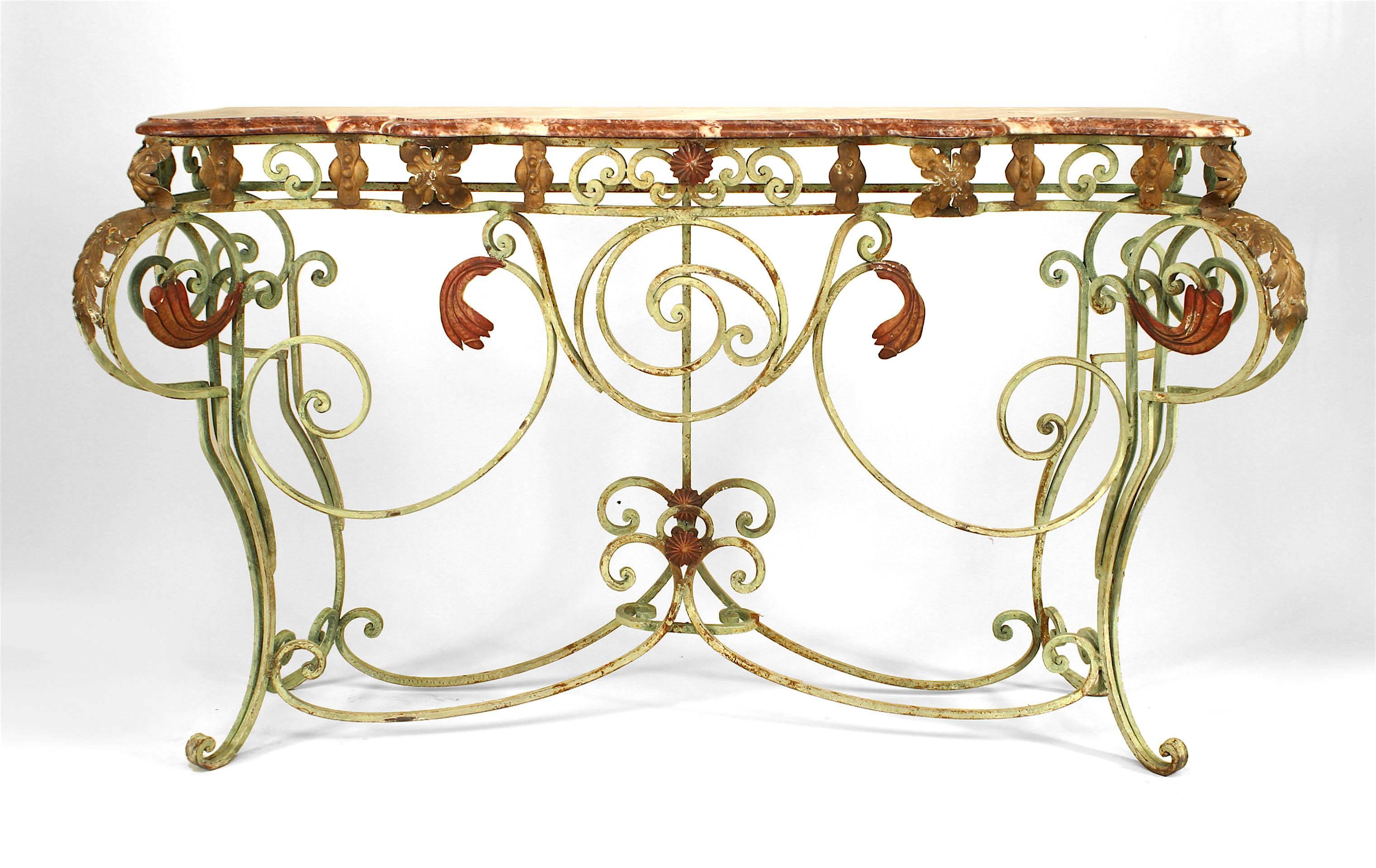 French Victorian-style (19/20th Century) green painted iron console table with scroll design legs and stretcher with red & gold leaf trim and rouge marble top. (Related item: 062069)
