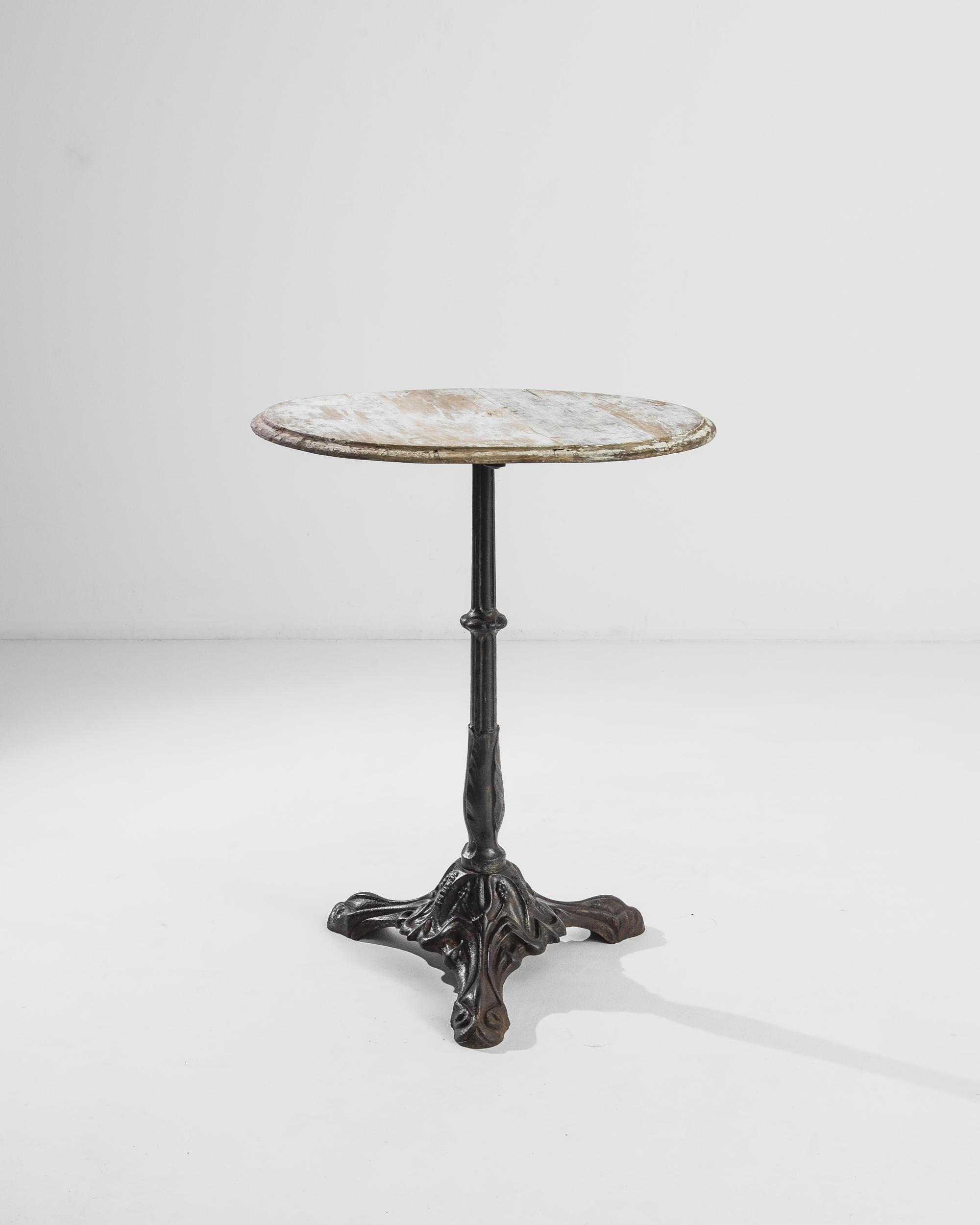This circular bistro table from turn of the century France provides a delightful fragment of design history. The metal base draws inspiration from the iron pavilions of the Paris Exhibition, the event which introduced Art Nouveau to the world.