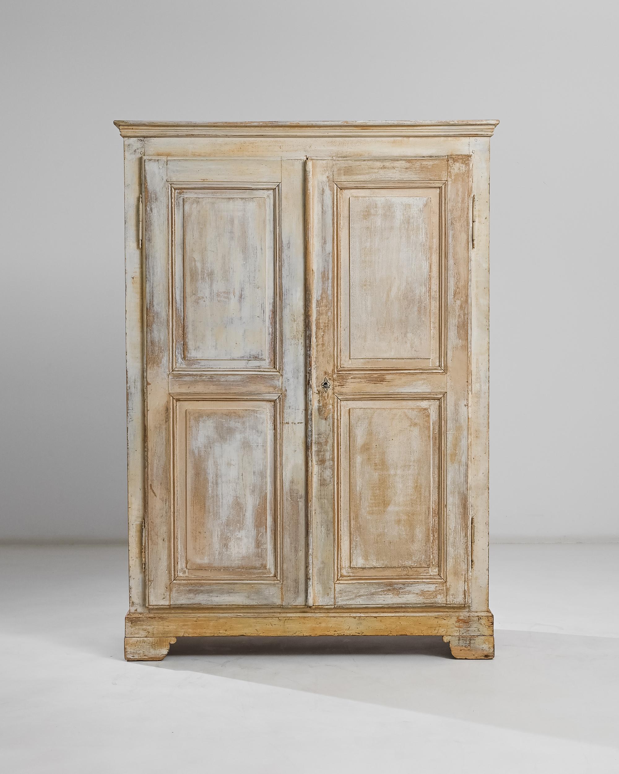 This wooden cabinet was produced in France, circa 1900. Crowned by a molded cornice, this five-shelf cabinet elevates to just under six feet high and balances its upright case on top of four bracket feet. Exhibiting a pleasing patina, the wood