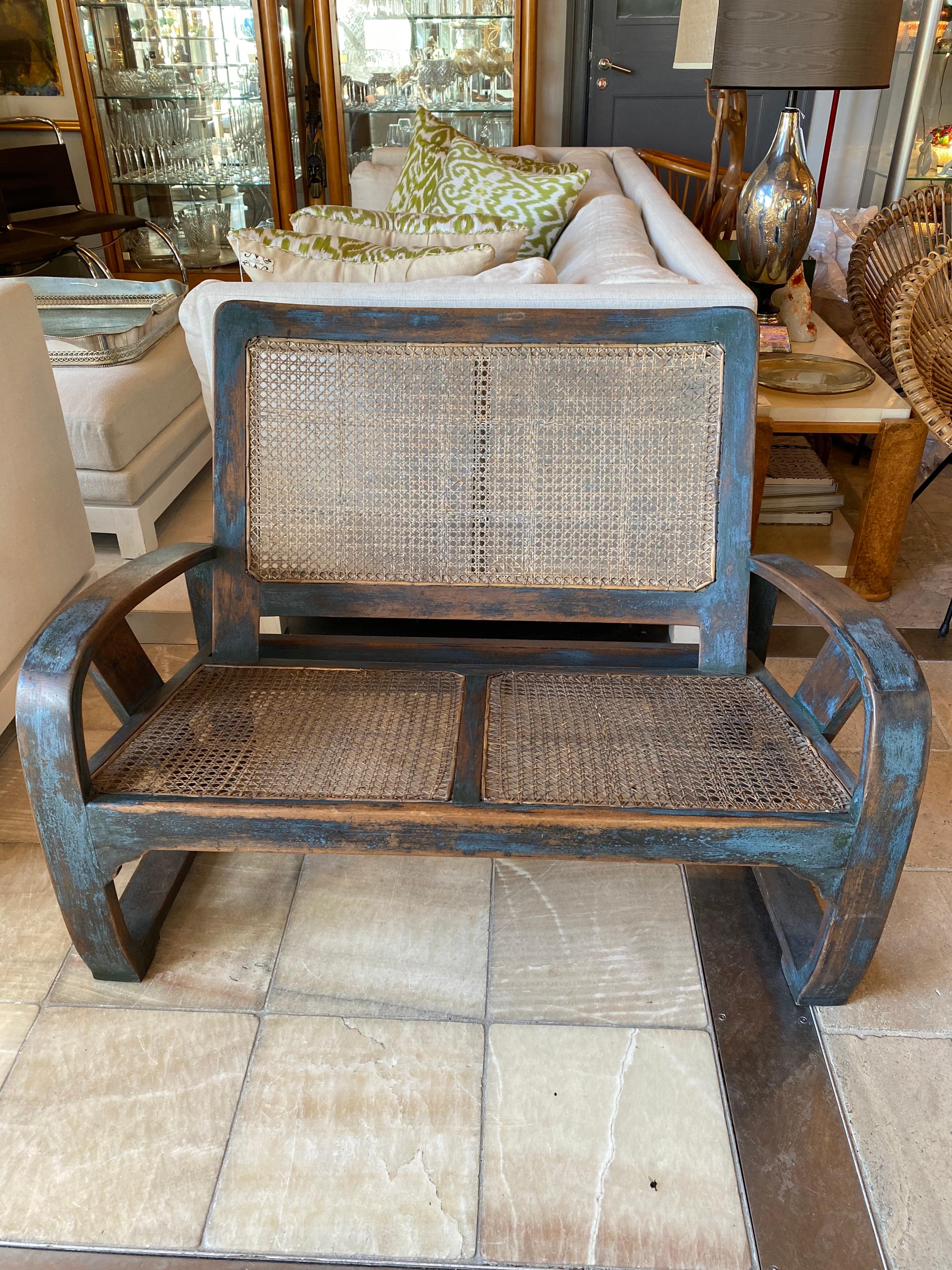 Turn of the century Indonesian Dutch colonial rubbed lacquer sette with caned seat.

Measures: 40