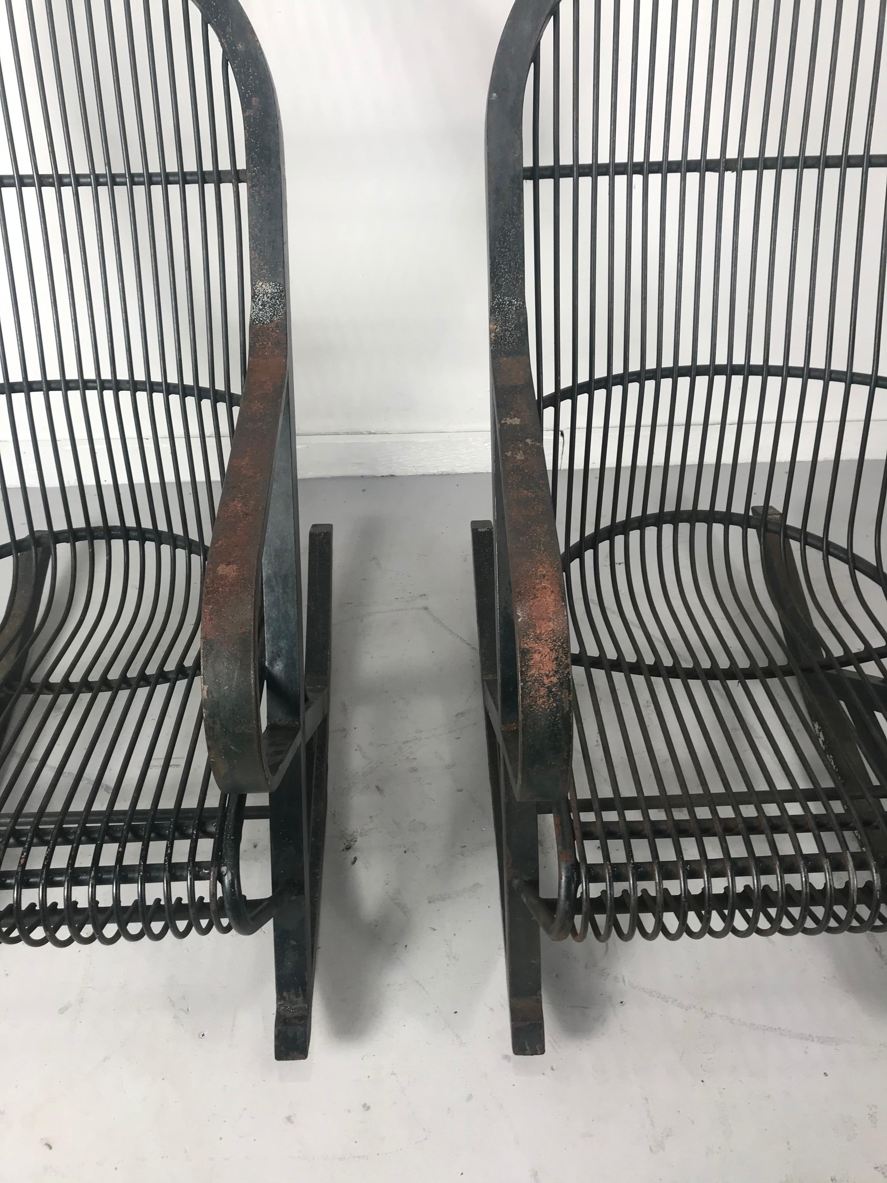 Amazing pair of all metal Industrial rocking chairs manufactured by the Trudo mfg co. Superior quality and construction. Everlasting comfort chair, chairs retain original metal label, Amazing original paint, finish, patina. Indoor or outdoor garden