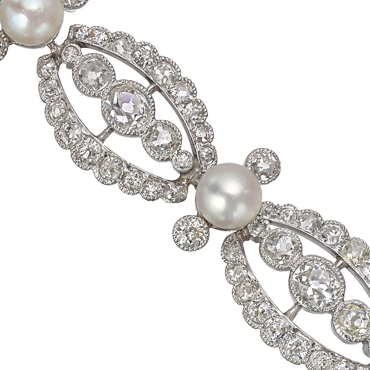 Fine antique link bracelet, featuring openwork old mine-cut diamond-set links separated by round pearls, in platinum, circa 1900. 184 diamonds weighing approximately 9.12 total carats. 7.25