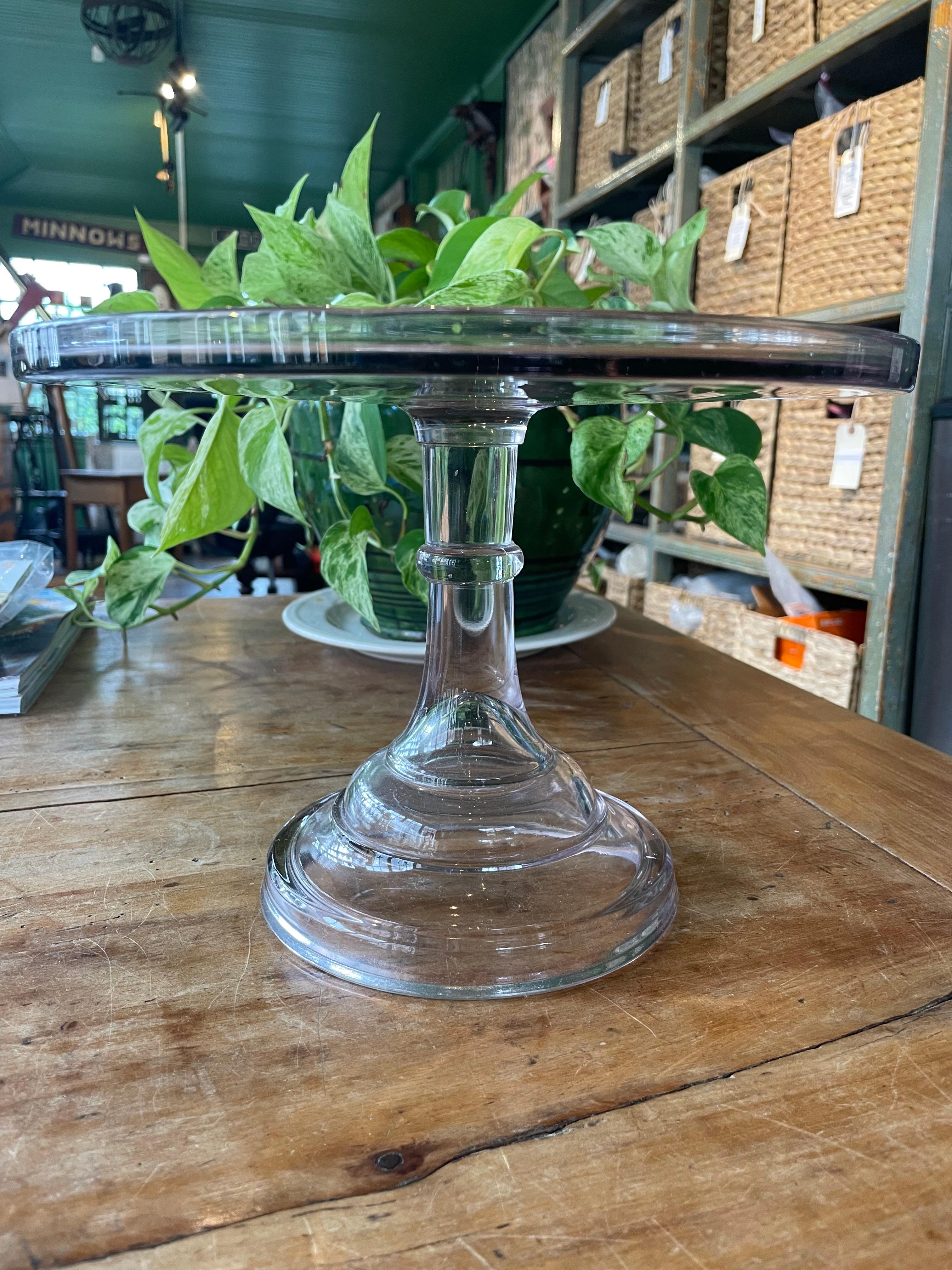 Turn of the century clear glass cake stand with hint of lavender color (likely due to age).  Pittsburgh glass, circa 1900.