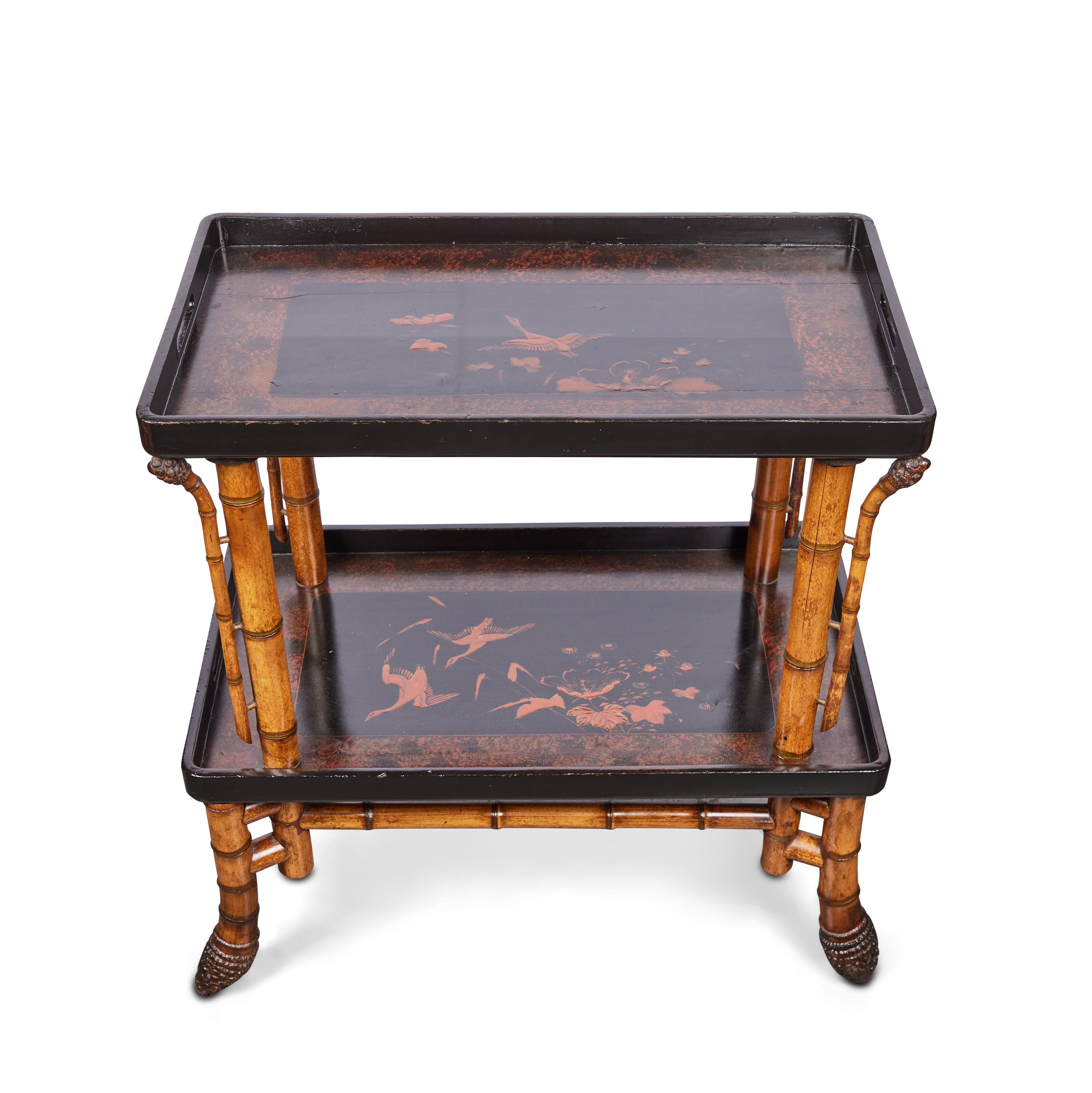 A chic, c. 1900, hand-carved elephant bamboo table with two, hand-painted, Chinoiserie, lacquer trays. Private collection- France.