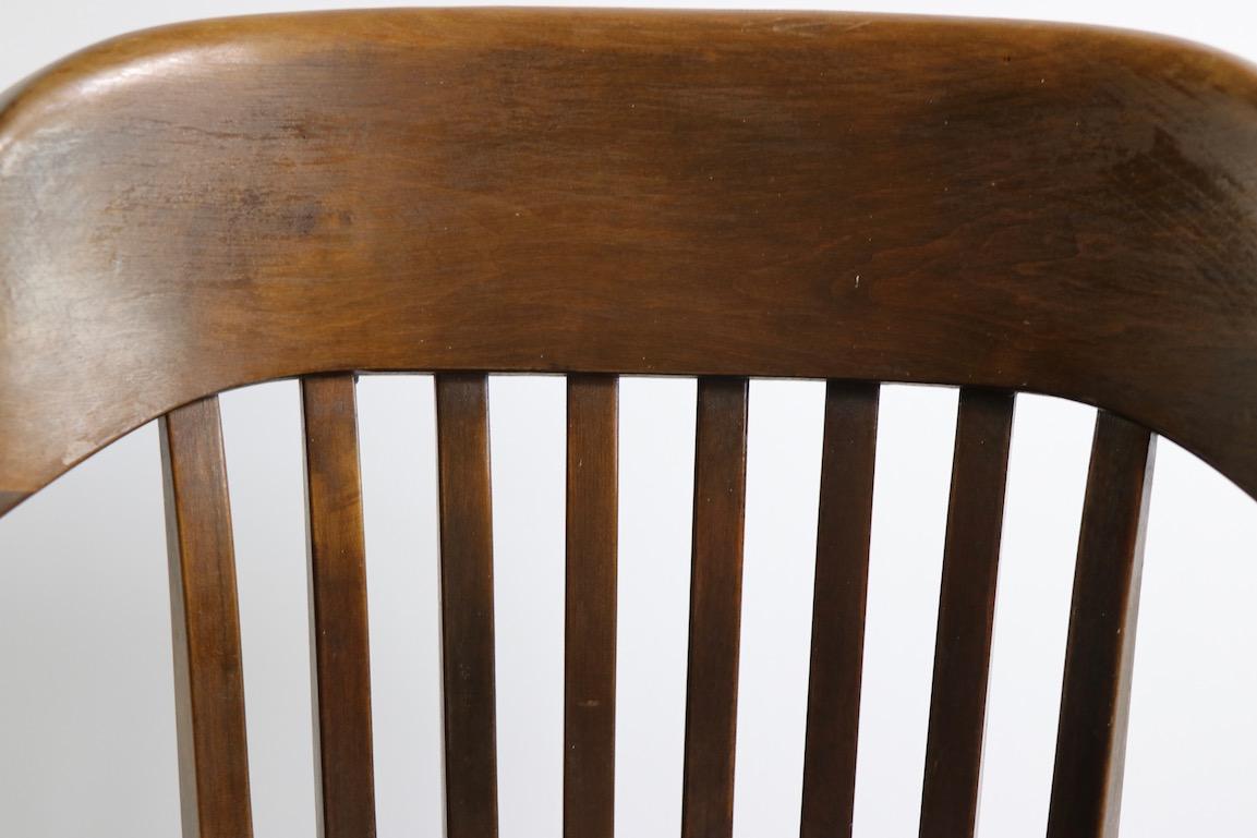 Classic swivel tilt office, desk chair probably either Gunlocke or B. L. Marble manufacture, circa 1920s-1940s. This example shows significant wear to the finish, as illustrated in pictures. Non structural damage or repairs, cosmetic wear evident.