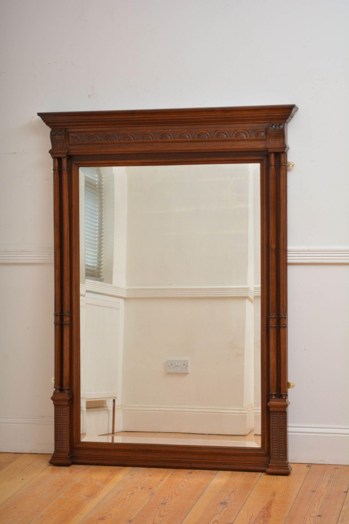 Sn5637 Very attractive turned of the century walnut console table mirror / pier mirror with original glass with bevelled edge and minor foxing. The frame having cavetto cornice with carved frieze, double columns with ringed capitals and carved