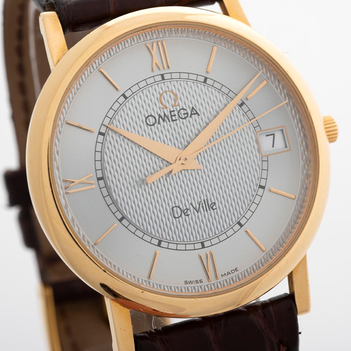 Our rare, turn of the millennium Omega De Ville Prestige, reference 73203412 features a classically proportioned case in 18ct yellow gold measuring 32.5mm (34.4 inc crown) by 37.5mm lug to lug, with quartz movement. The guilloche textured silver