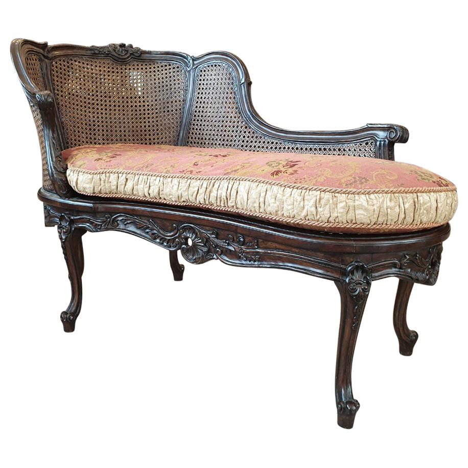 Turn of the 19th-20th Century Dark Wood Chaise Lounge Finished with Rattan For Sale