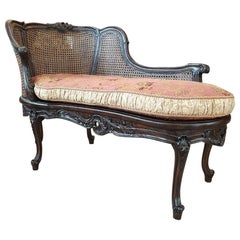 Antique Turn of the 19th-20th Century Dark Wood Chaise Lounge Finished with Rattan