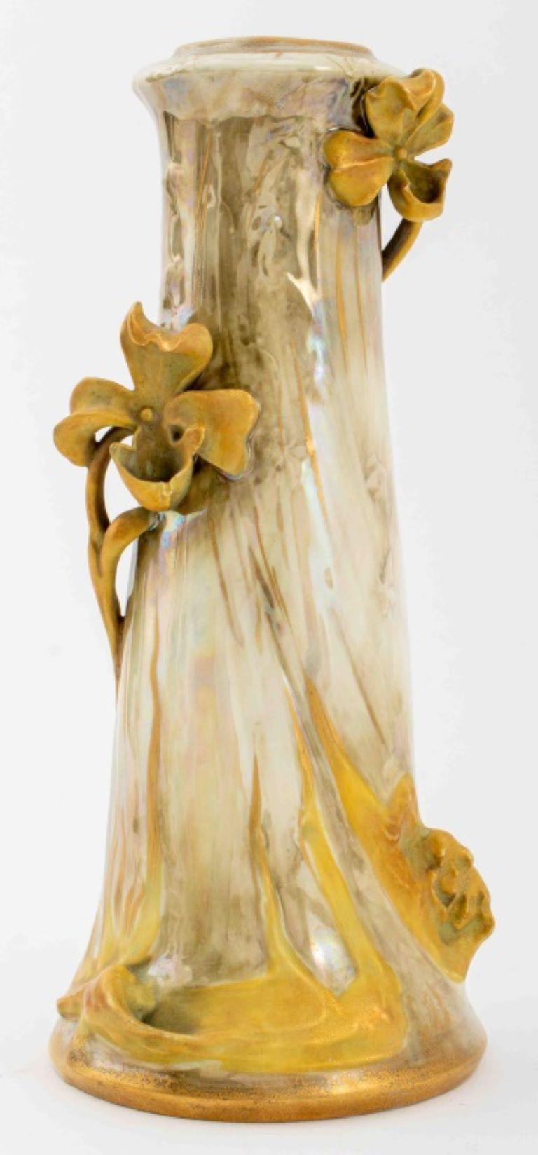 Turn-Teplitz Amphora Austrian ceramic pottery vase, circa 1900, of tapering cylindrical form with conforming sinuous flowering vine handles and a lobed flare lip, glazed with a combination of earth tone matte and iridescent colors with hints of pink