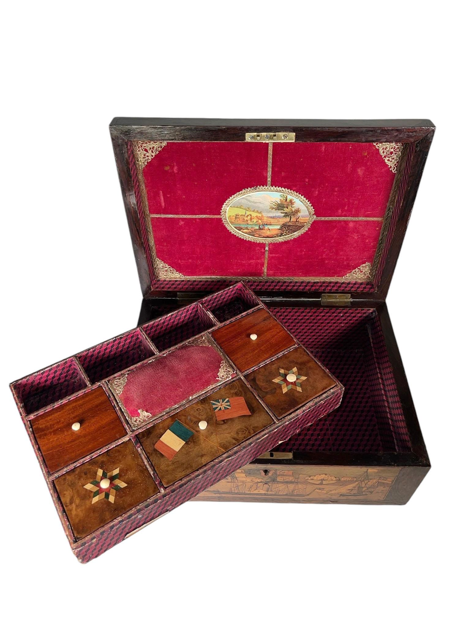 A 19th century Turbridge Trinity box with exotic marquetry woods of ships etc. England, circa 1890.  