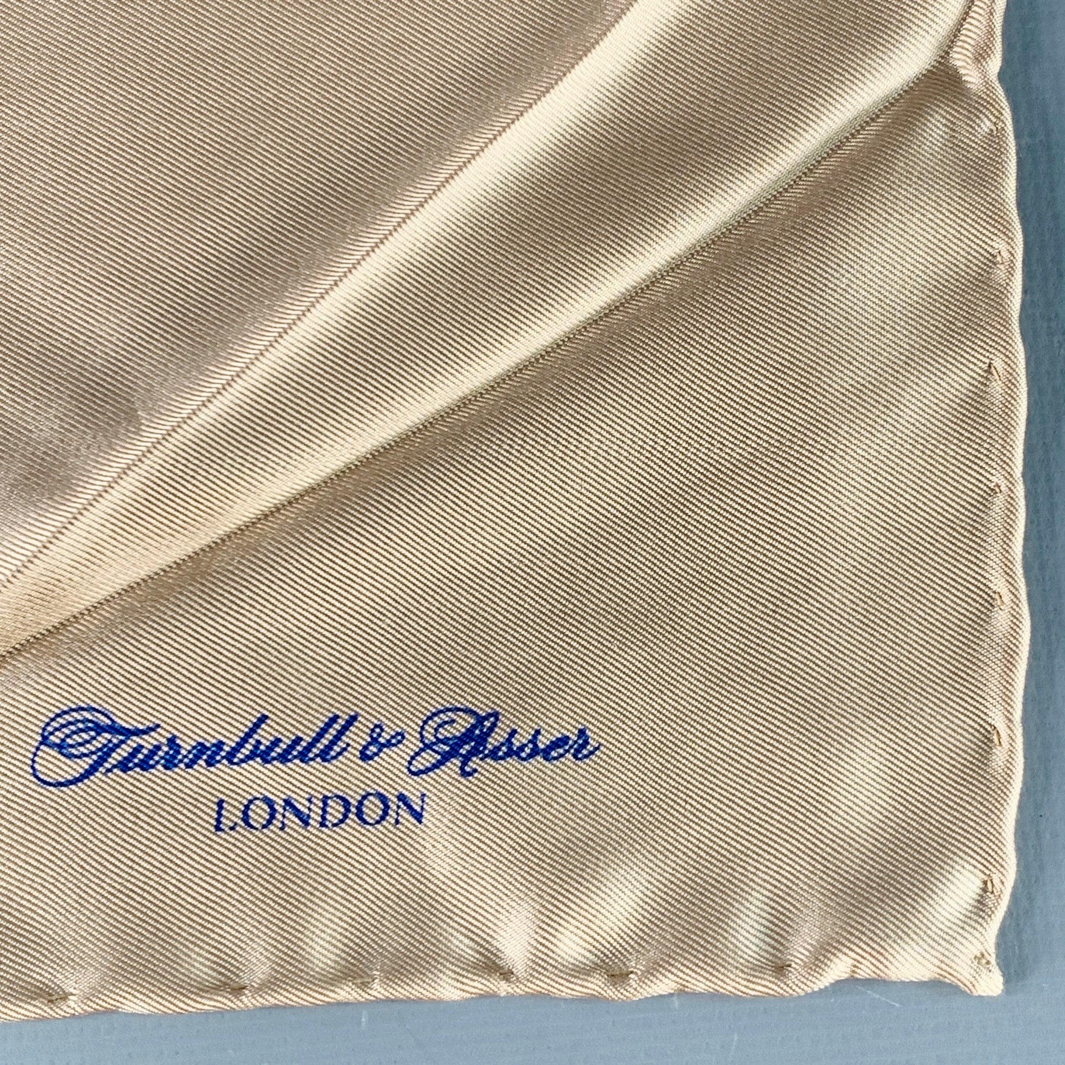 TURNBULL & ASSER pocket square in a beige silk featuring hand rolled edges.
Made in UK.Very Good Pre-Owned Condition.  

Measurements: 
  16.5 inches  x 16 inches 

  
  
 
Sui Generis Reference: 138824
Category: Pocket Square
More Details
   