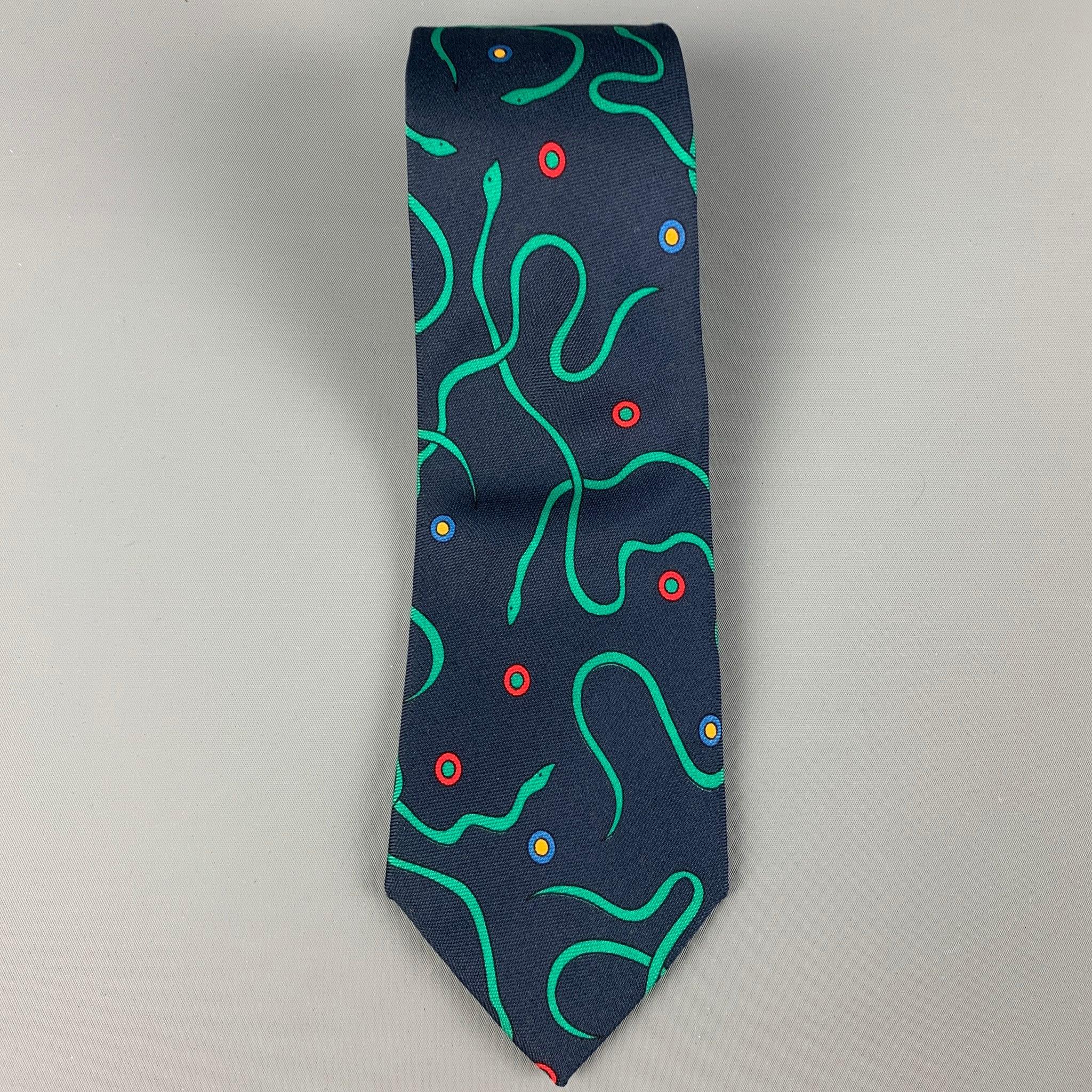 TURNBULL & ASSER necktie comes in a navy & green silk with a all over snake print. Made in England . Very Good Pre-Owned Condition.
Light wear. As-is.  

Measurements: 
  Width: 3.2 inches  / 8 cm. Length: 58.5 inches  / 148.5 cm.
  
  
 
Reference: