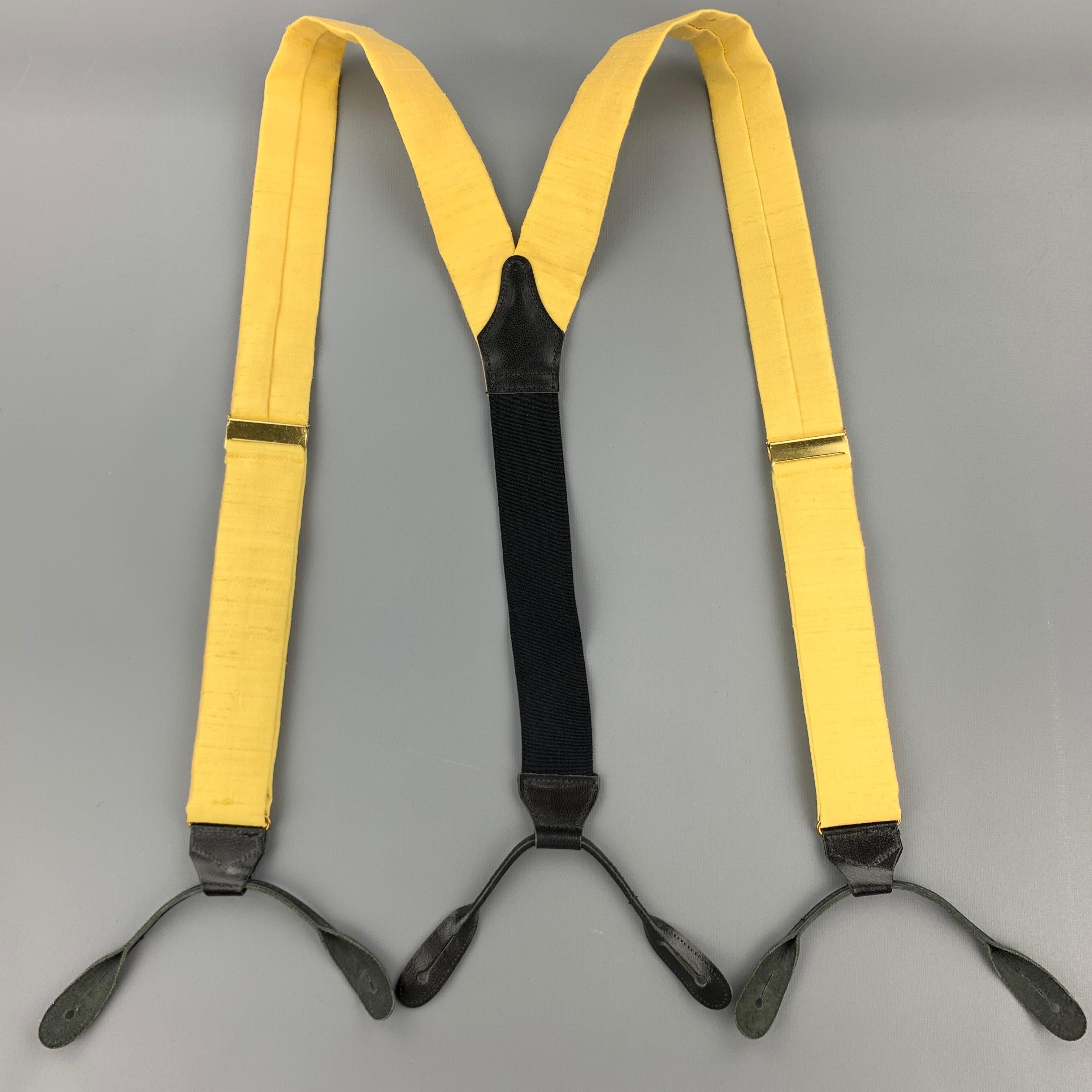 TURNBULL & ASSER suspenders comes in a yellow silk featuring a adjustable fit, leather trim, and includes trouser buttons. Made in England.

Excellent Pre-Owned Condition:

Measurements:

Width: 1.5 in.