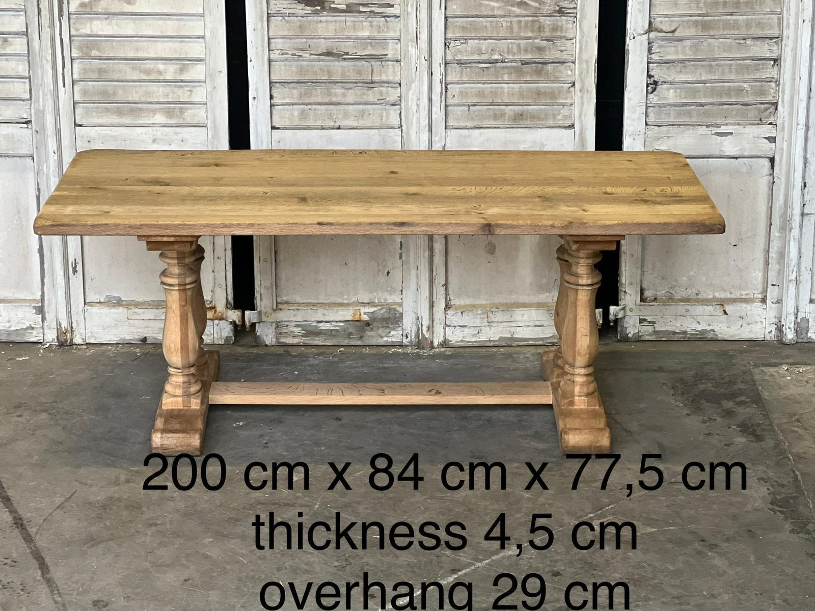 A good looking Trestle End Farmhouse Dining Table unusually having baluster turned leg trestles. French in origin and darting to the early 1900s, made from solid Oak which we have bleached for a lighter look and to bring out the natural beauty of