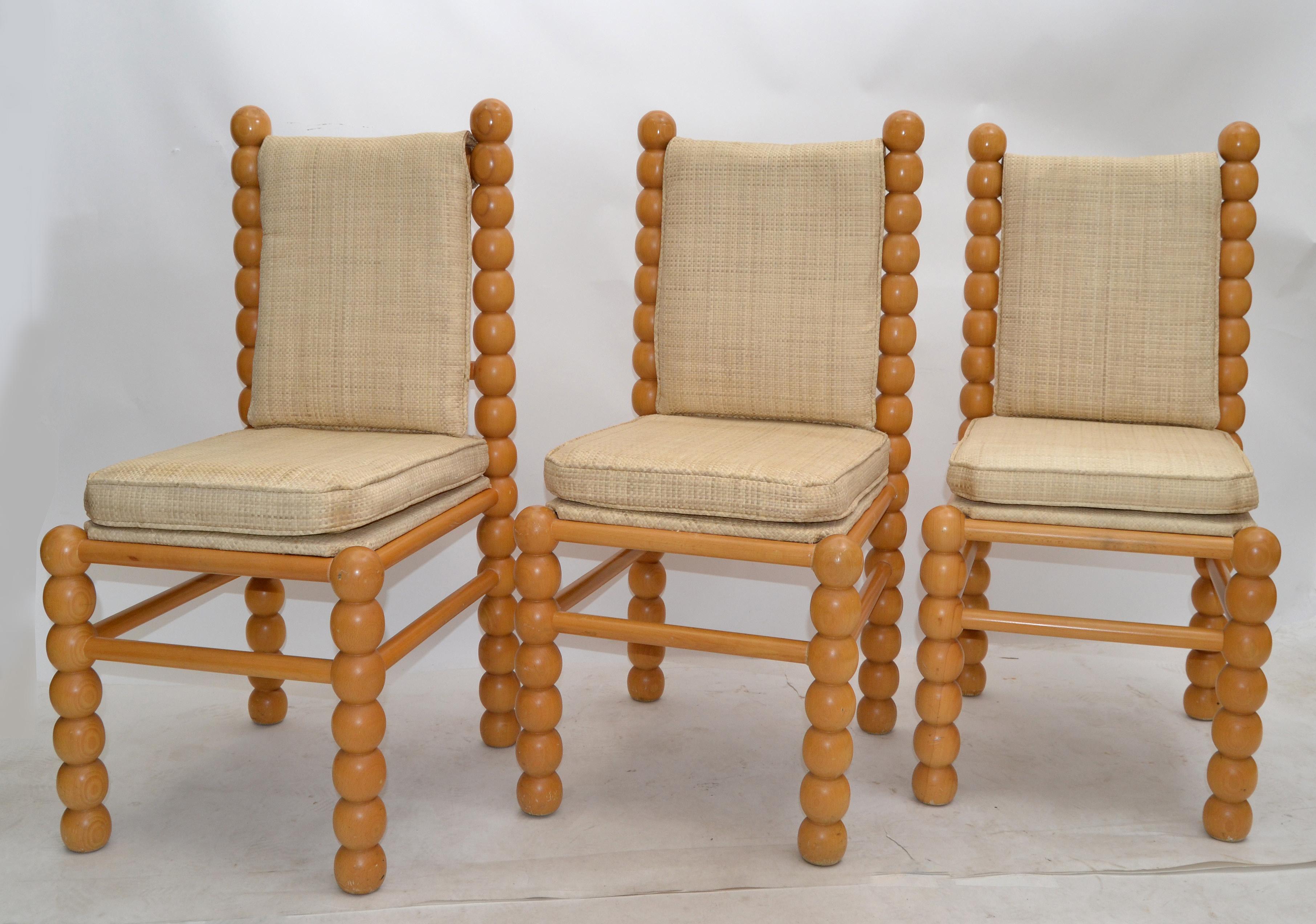 Three Mid-Century Modern side chairs or dining chairs from the late 1970s made in America.
Turned wooden frames and with a pale beige jute upholstery.
The chairs are super comfortable and great for a small space. 
  